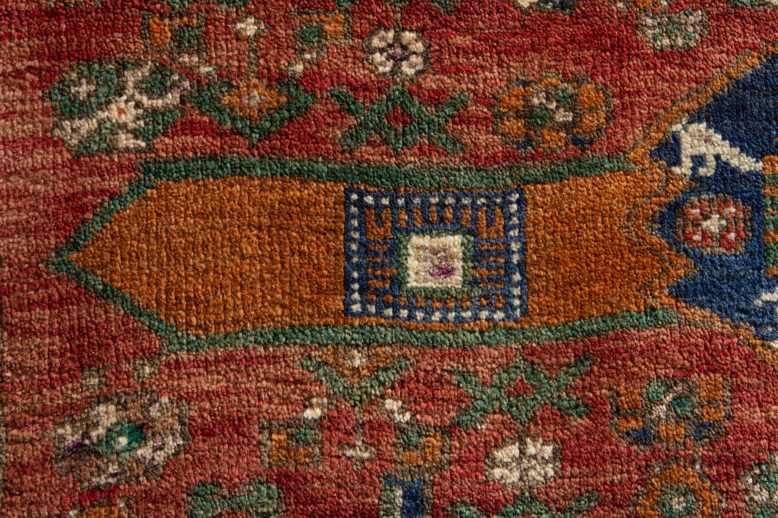 Persian Azerbaijan accent rug in rust and dark blue, view 6 of 8