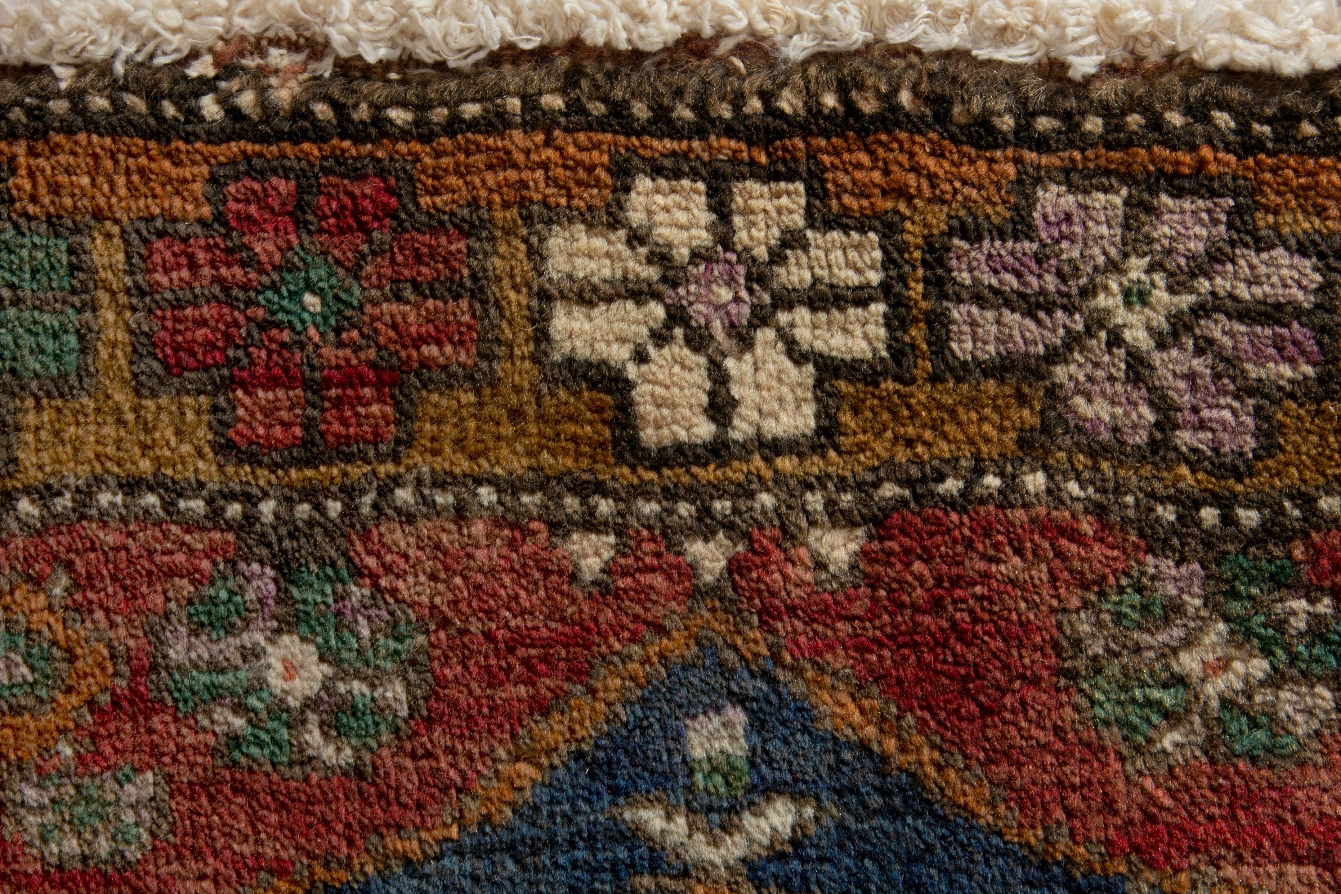 Persian Azerbaijan accent rug in rust and dark blue, view 7 of 8