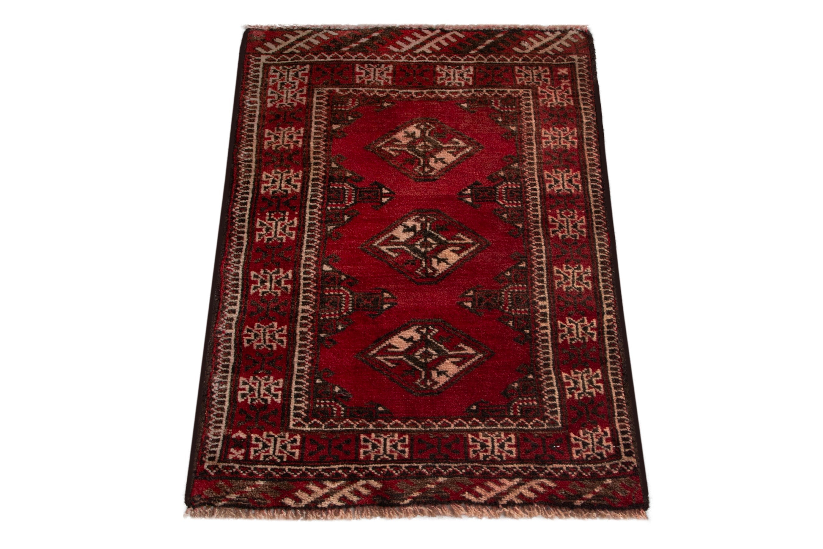Persian Torkaman accent rug in deep red and cream, view 2 of 8