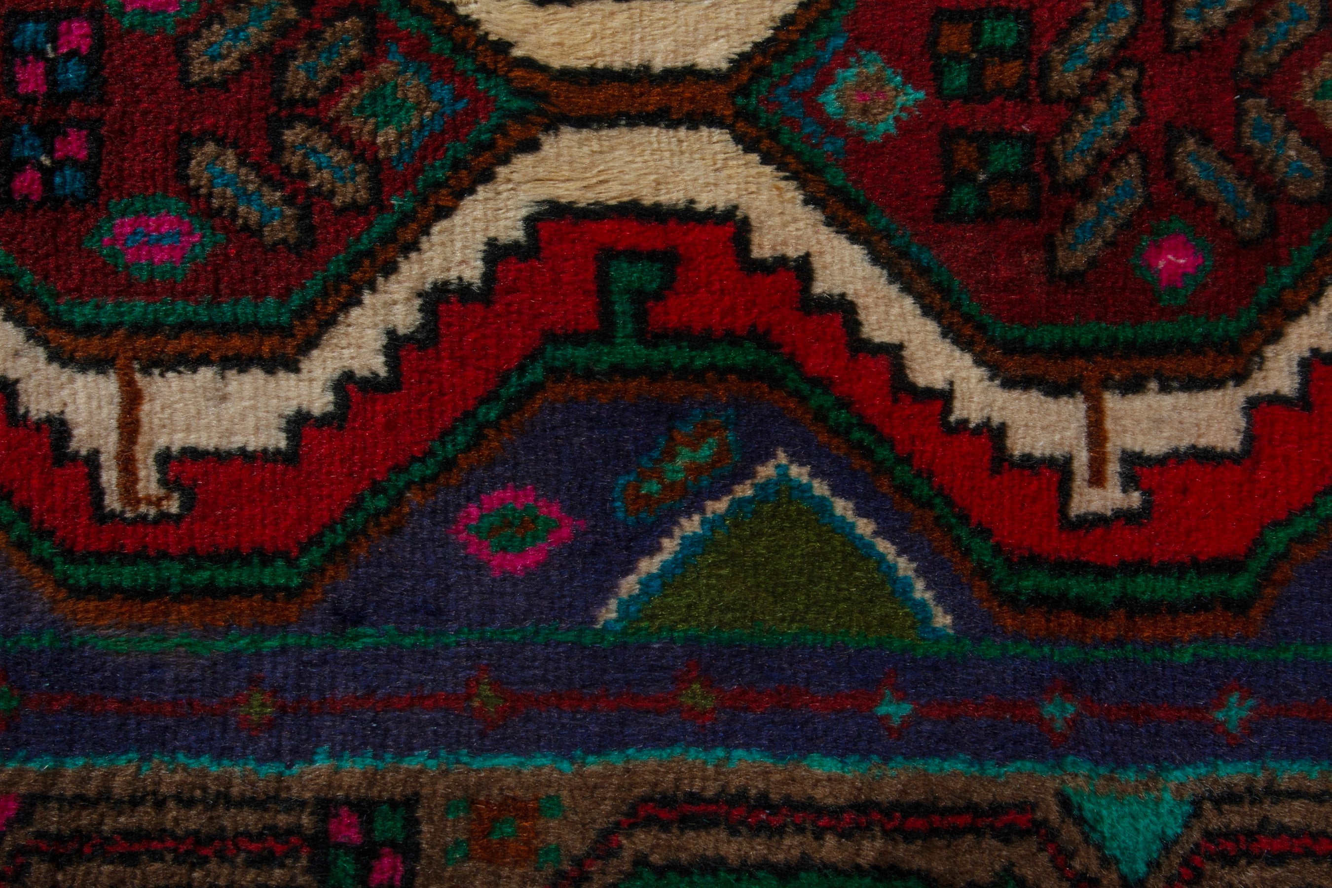 Persian Songhor accent rug in dark blue and deep red, view 6 of 8