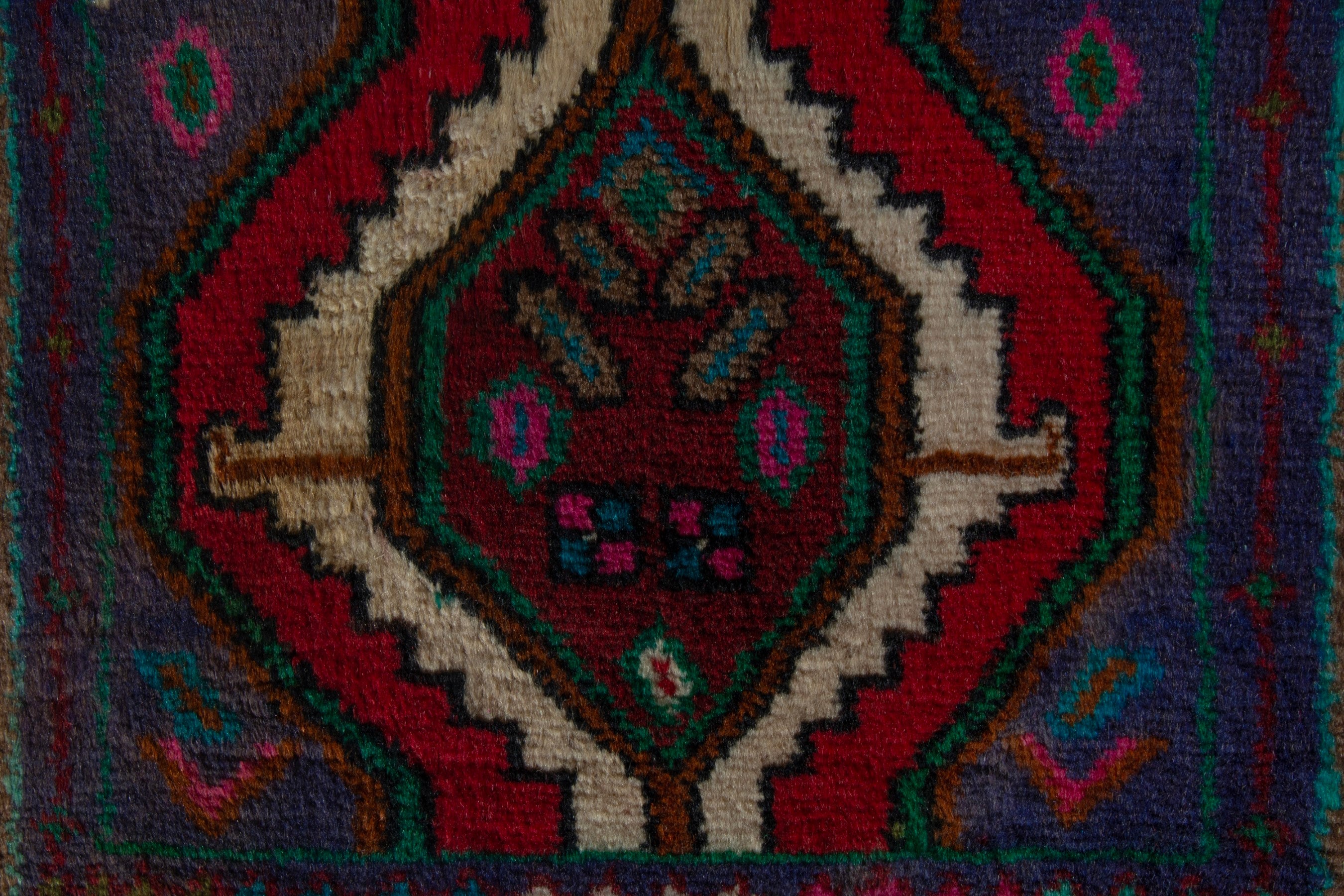 Persian Songhor accent rug in dark blue and deep red, view 7 of 8