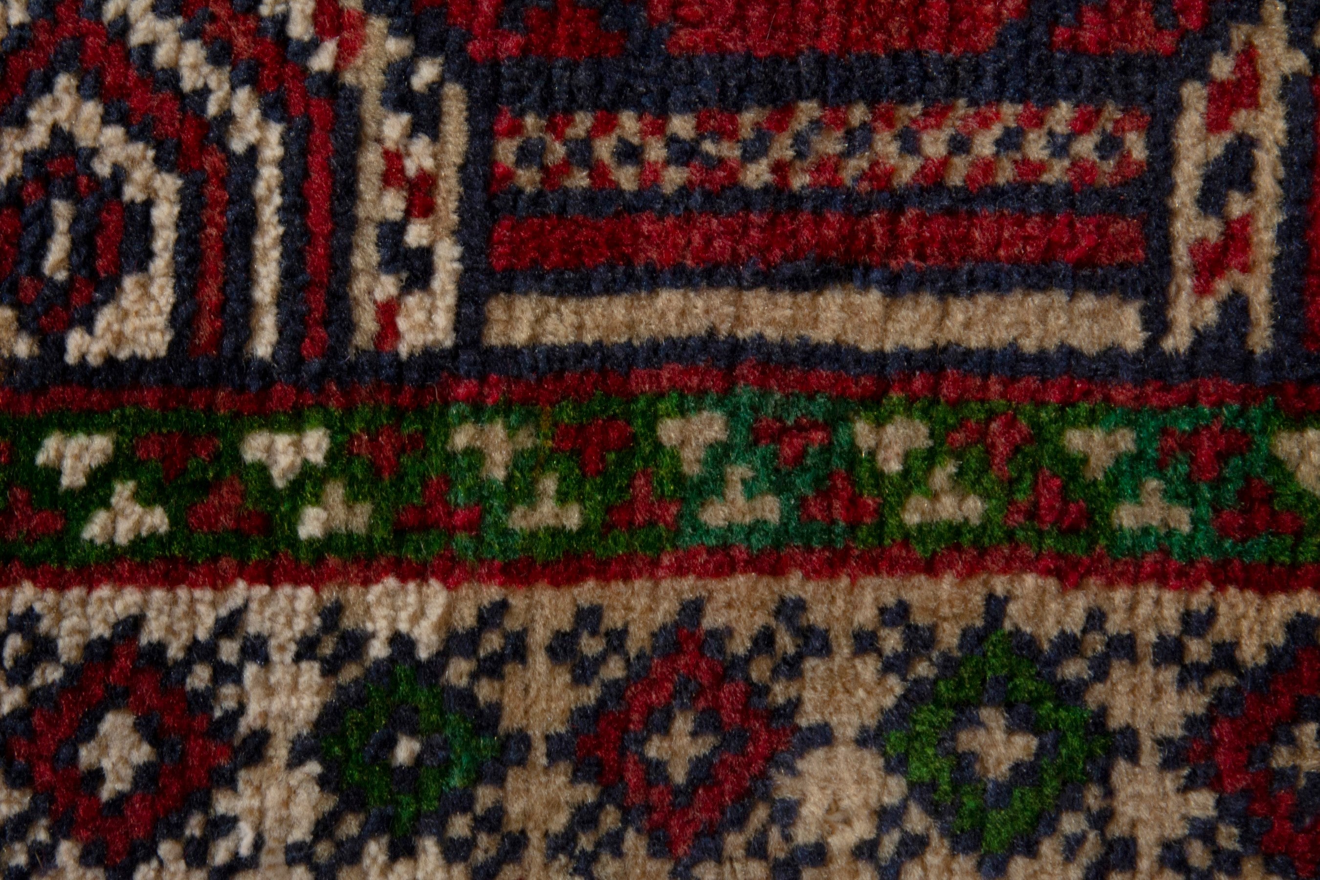 Persian Torkaman accent rug in deep red and burgundy, view 7 of 8