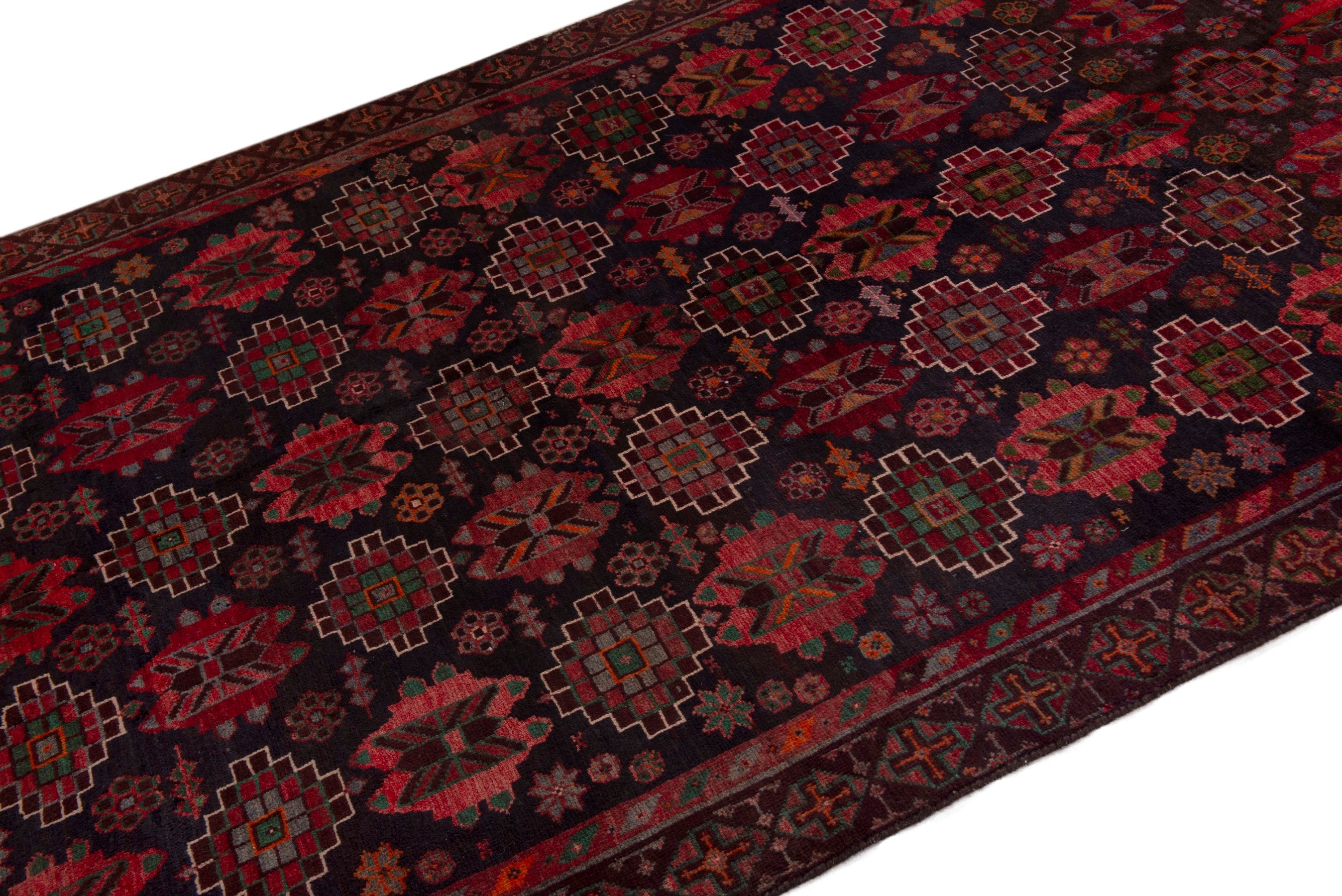 Persian Ferdos area rug in navy and deep red, view 4 of 20