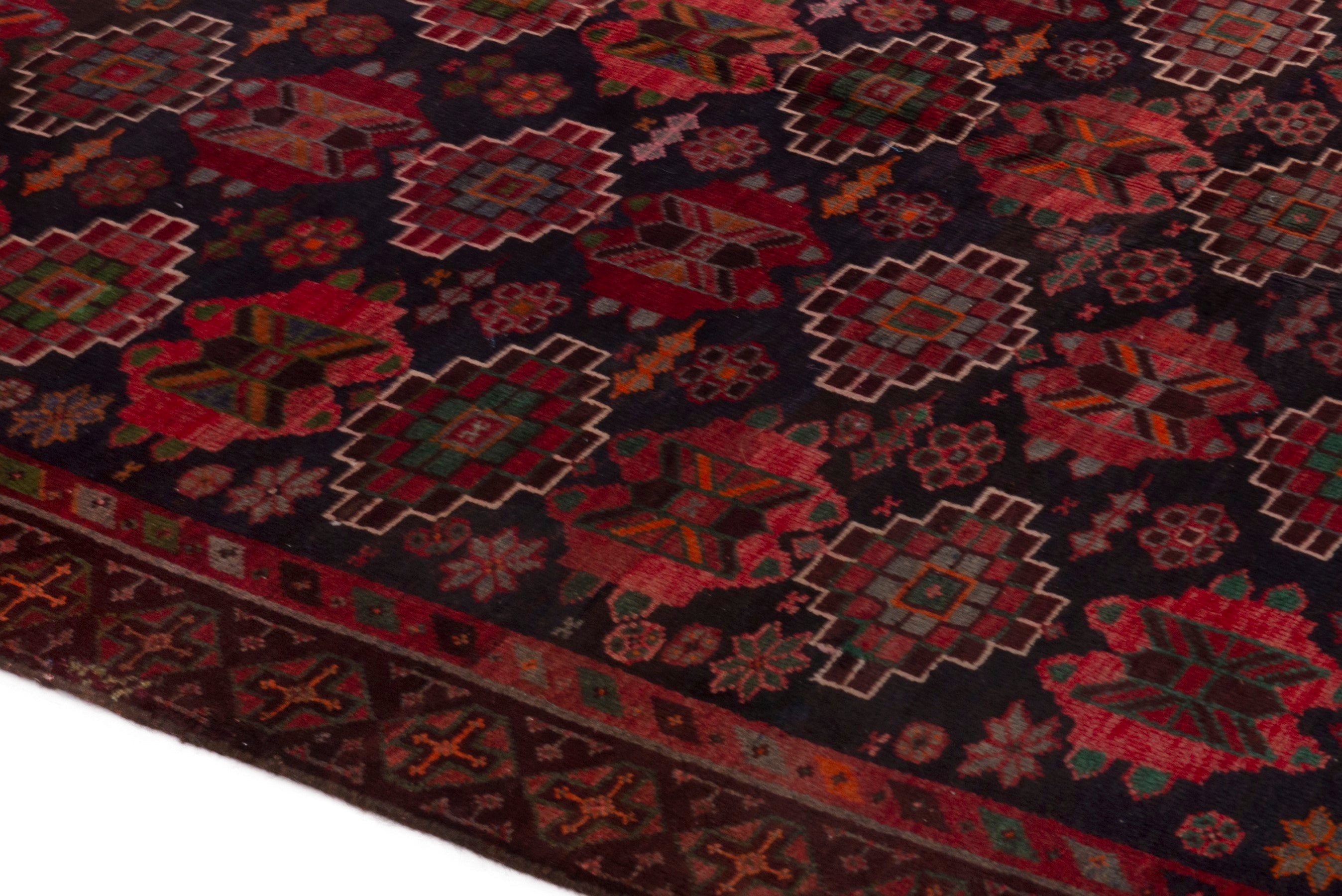 Persian Ferdos area rug in navy and deep red, view 8 of 20