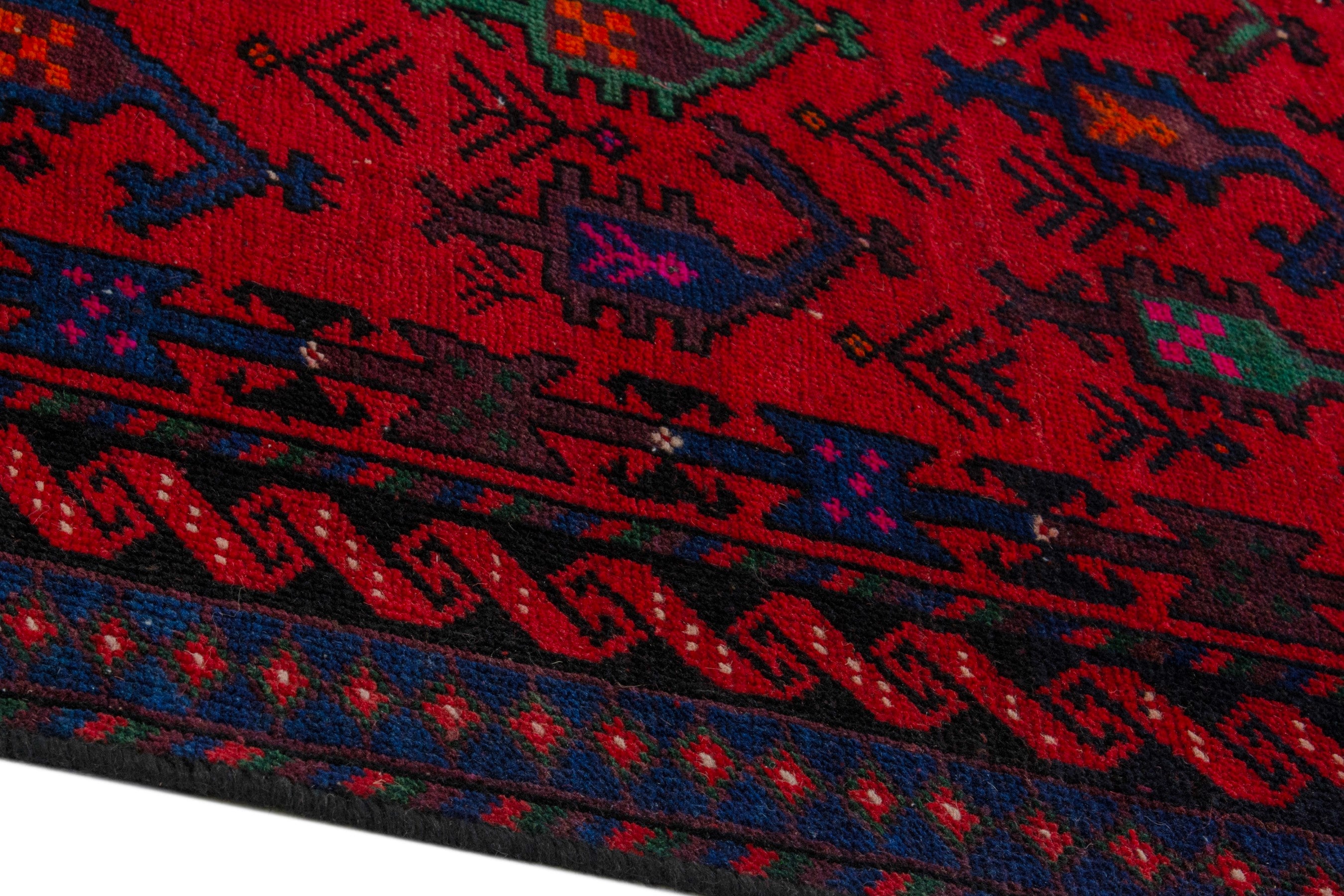 Persian Ghoochan area rug in deep red and navy, view 10 of 21