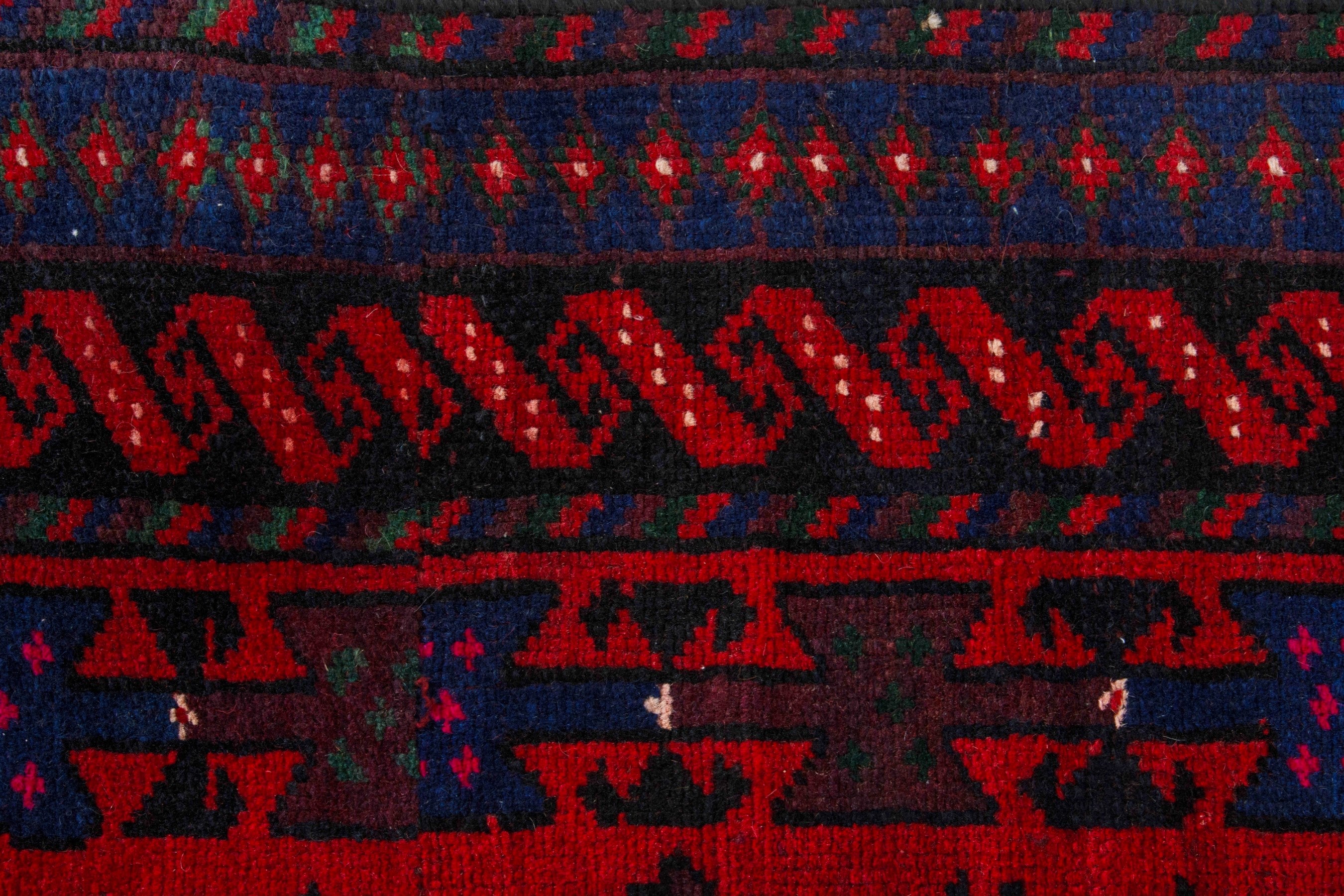 Persian Ghoochan area rug in deep red and navy, view 15 of 21