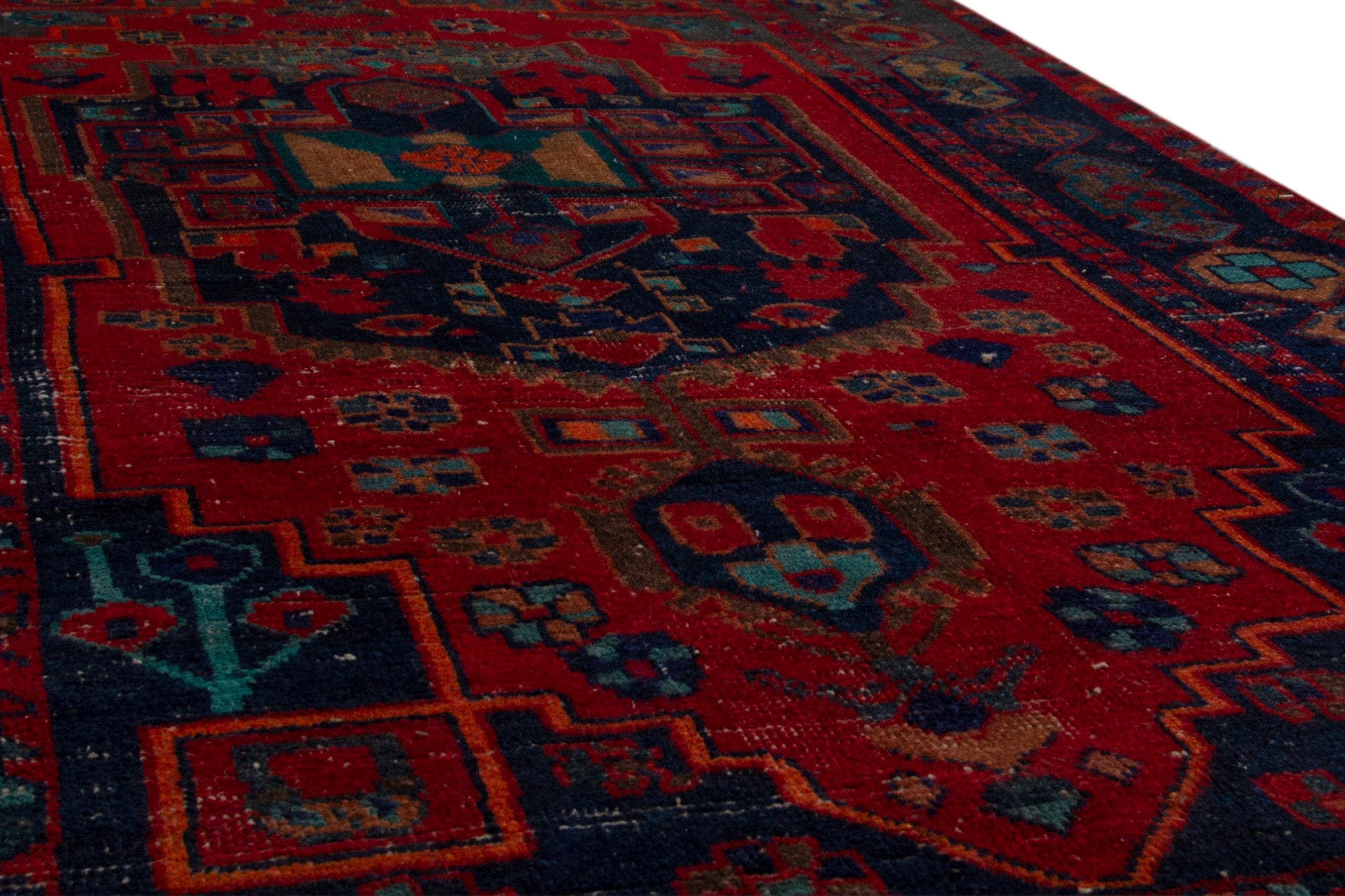 Persian Lori area rug in deep red and dark teal, view 11 of 19