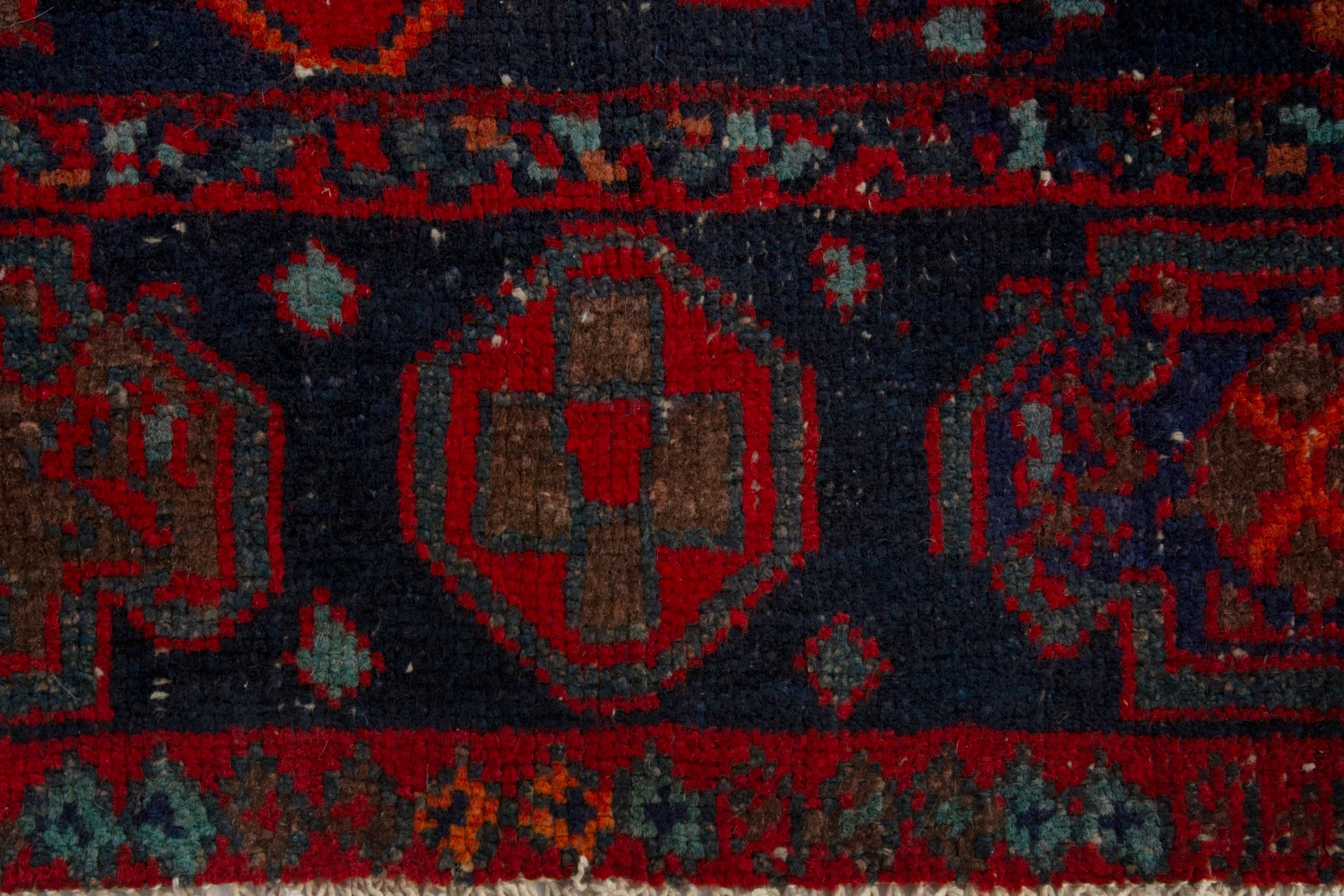 Persian Lori area rug in deep red and dark teal, view 12 of 19
