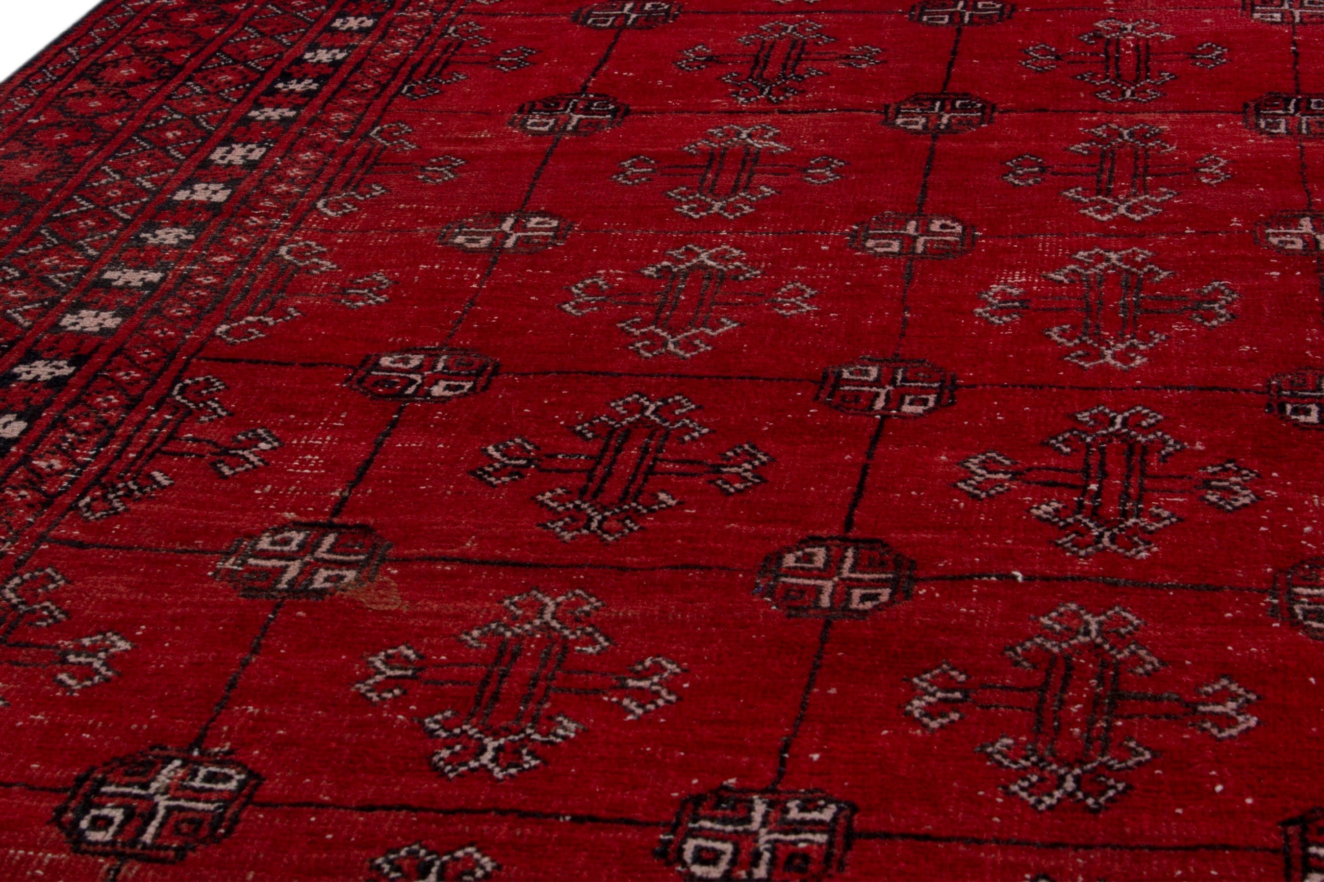 Persian Torkaman area rug in deep red and burgundy, view 9 of 19