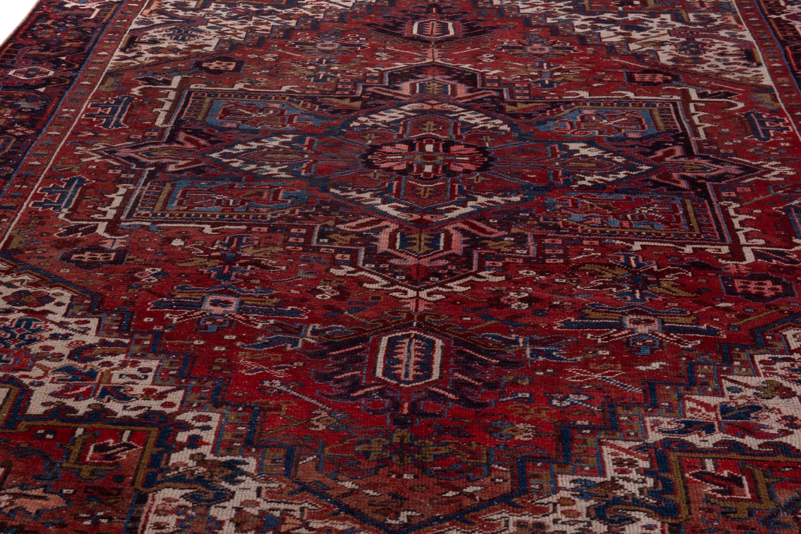 Persian Heriz oversized rug in deep red and cream, view 8 of 21
