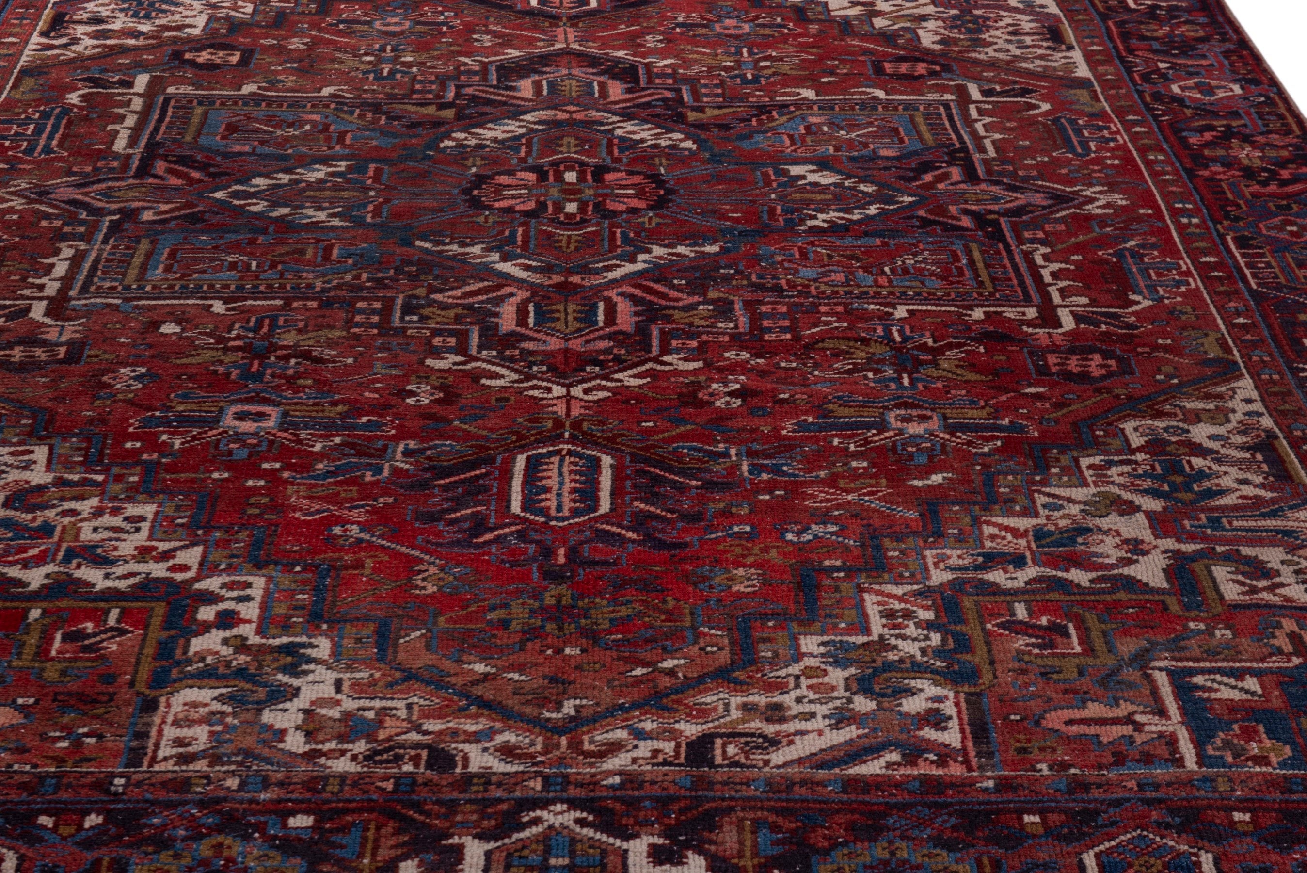 Persian Heriz oversized rug in deep red and cream, view 9 of 21