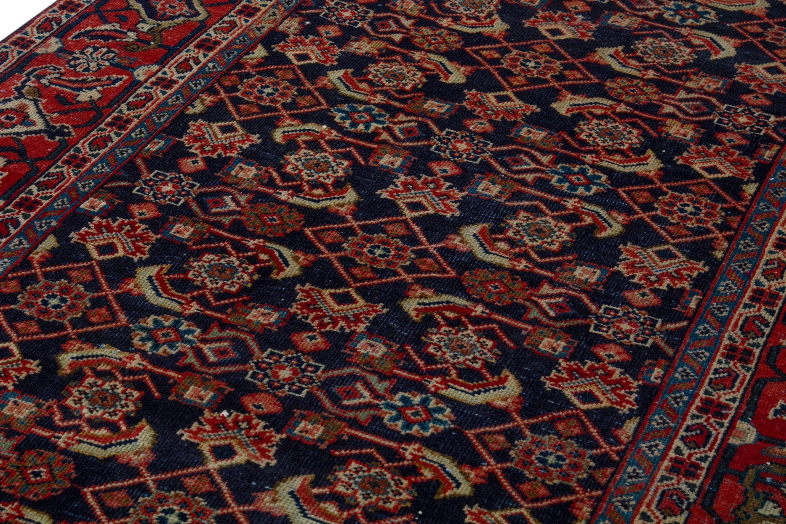Persian Mahal area rug in navy and deep red, view 9 of 17