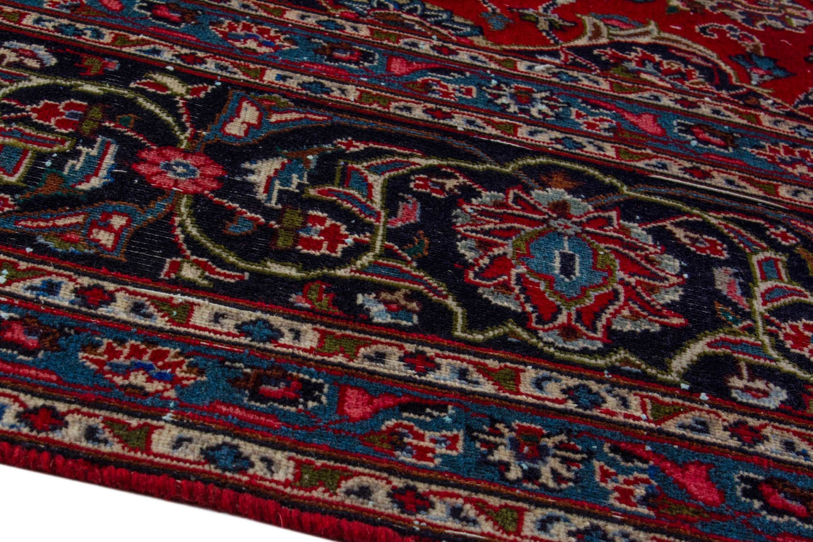 Persian Mashhad oversized rug in deep red and charcoal, view 8 of 19