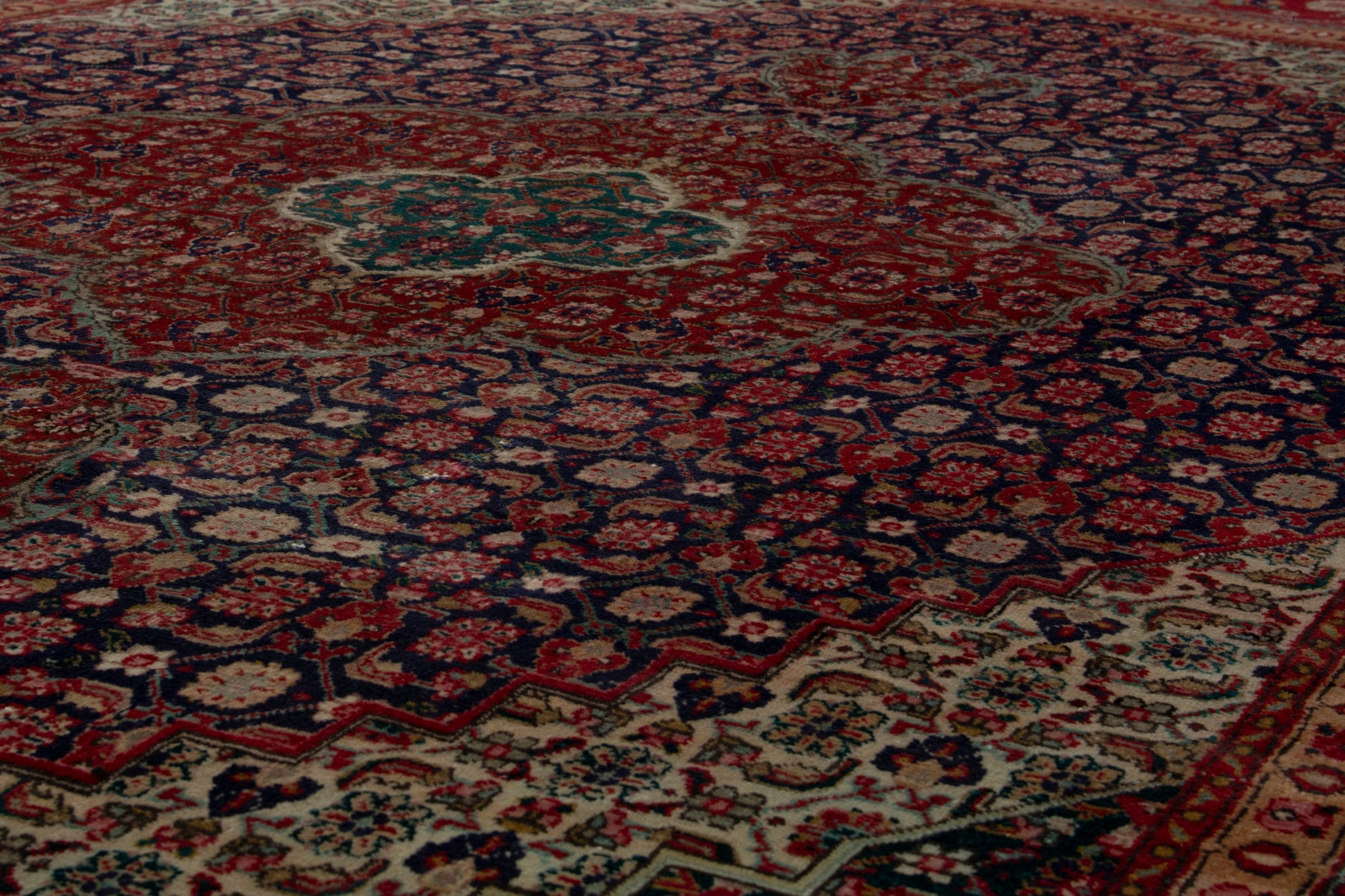 Persian Tabriz oversized rug in deep red and dark blue, view 10 of 18