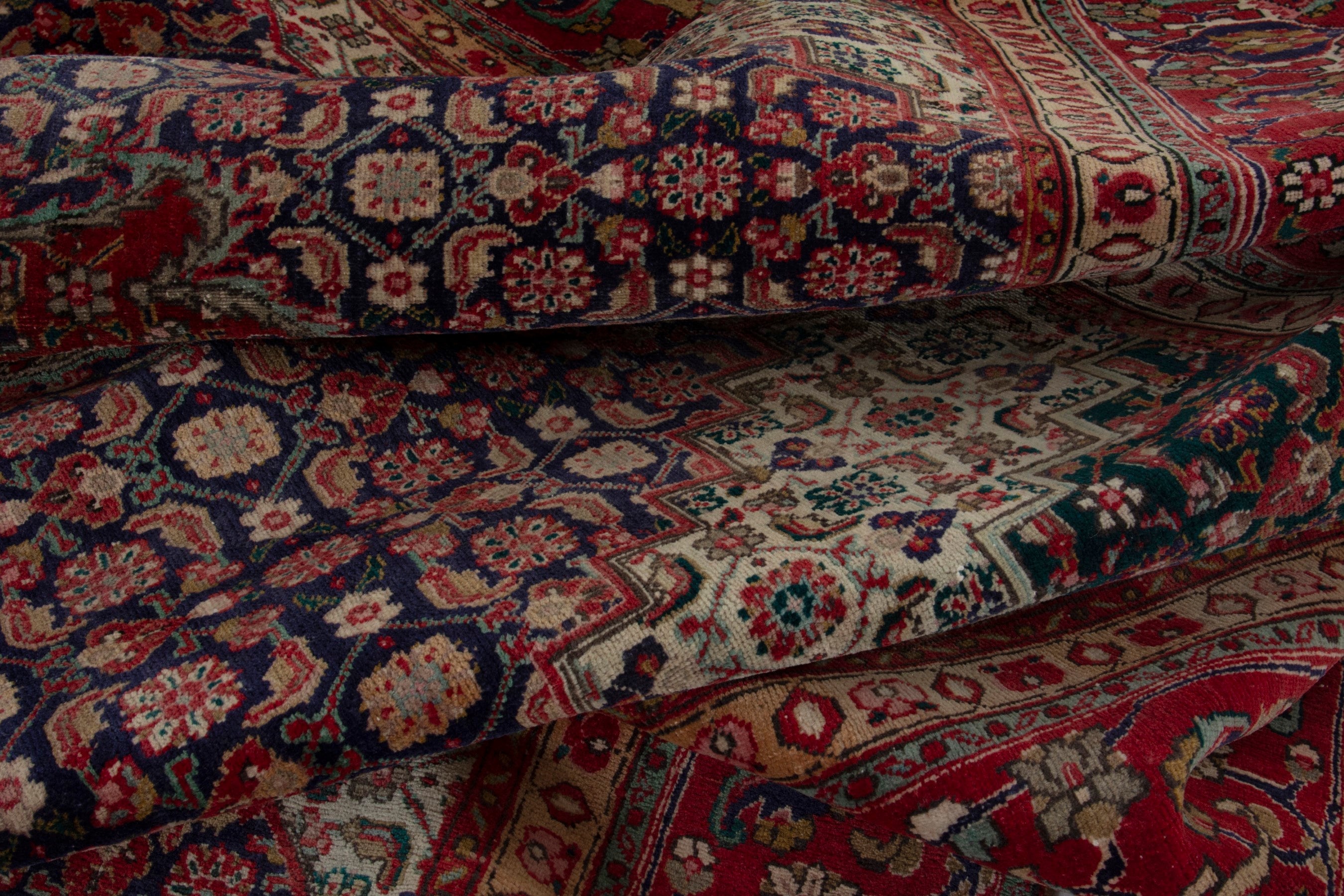 Persian Tabriz oversized rug in deep red and dark blue, view 17 of 18