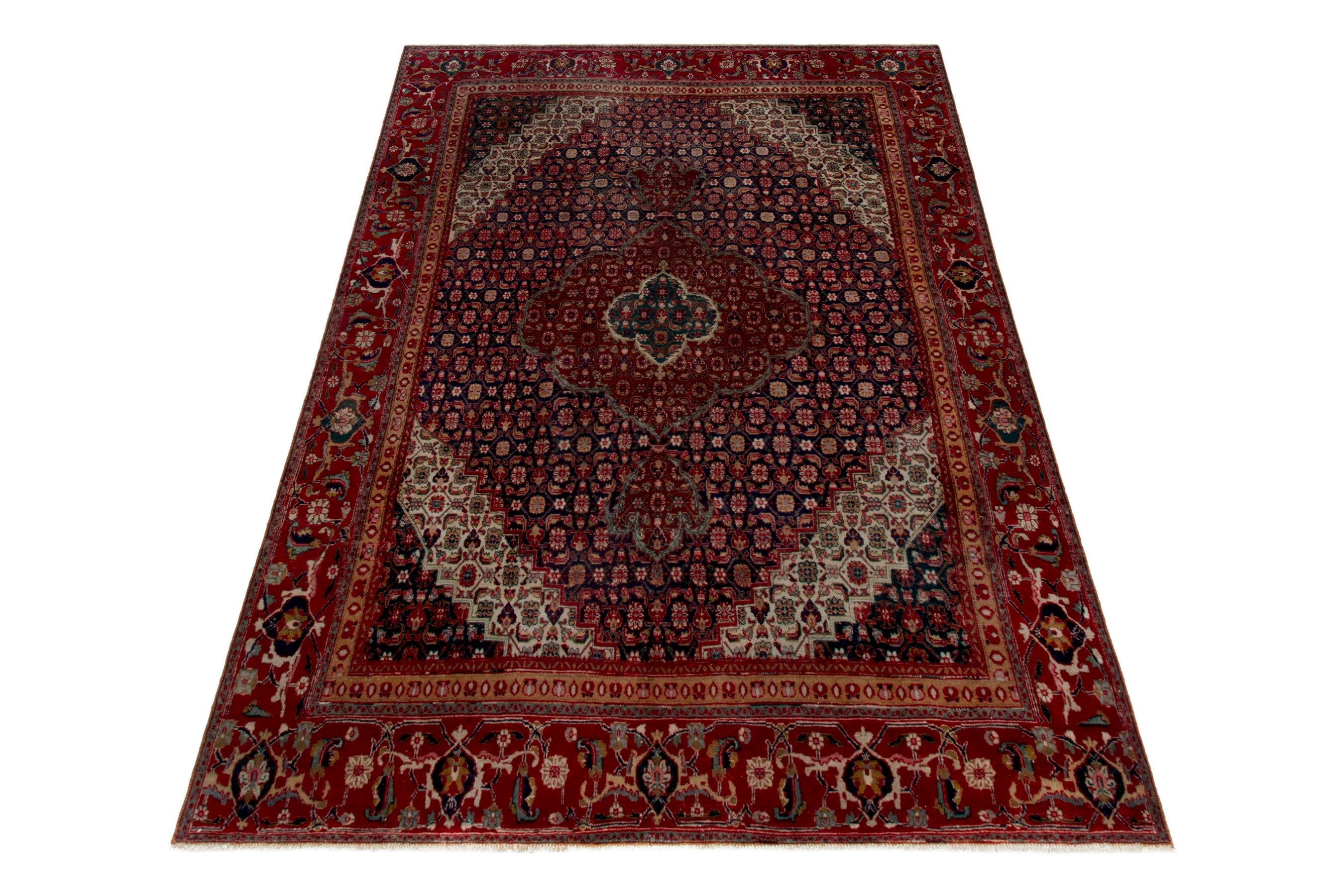 Persian Tabriz oversized rug in deep red and dark blue, view 3 of 18