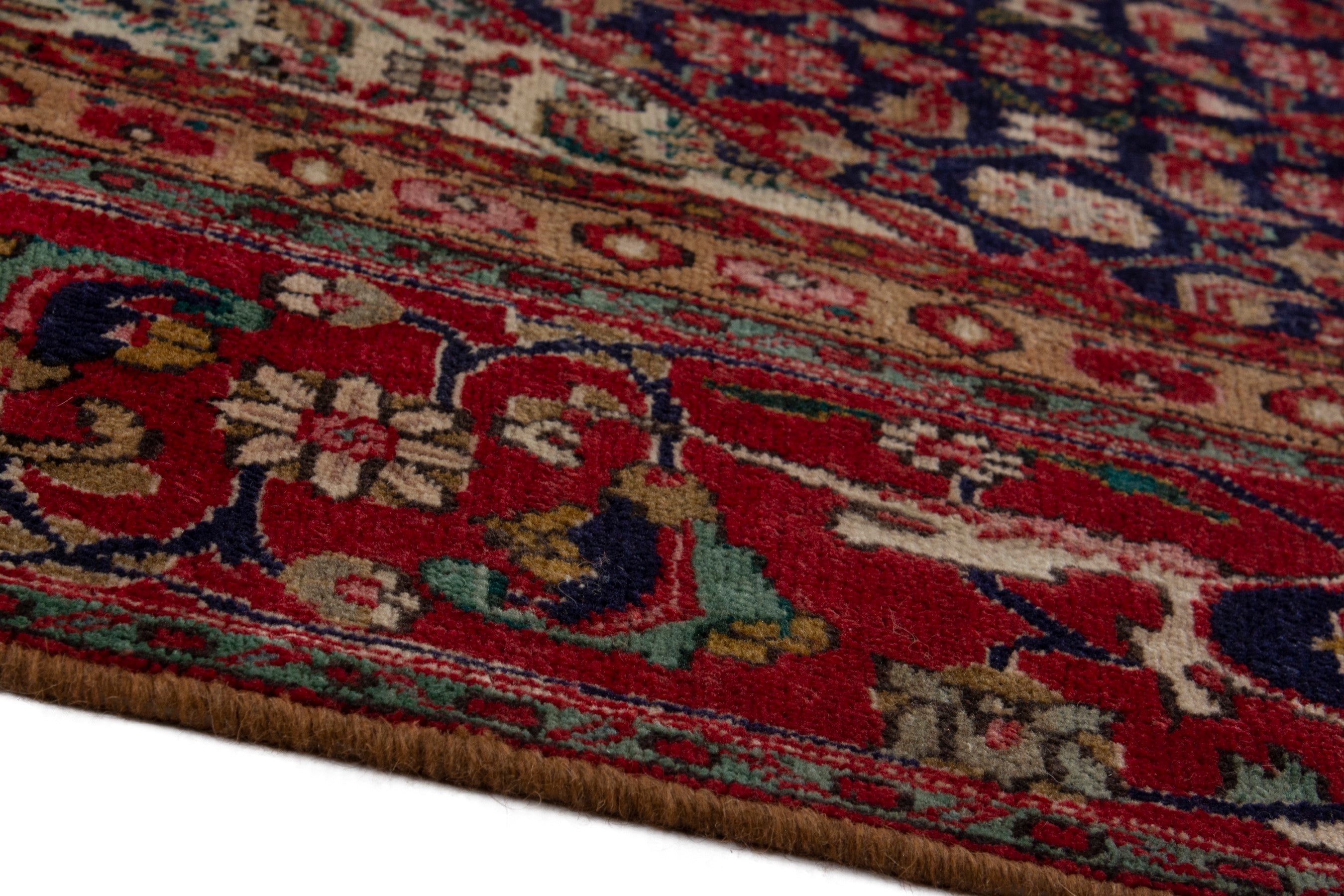 Persian Tabriz oversized rug in deep red and dark blue, view 8 of 18