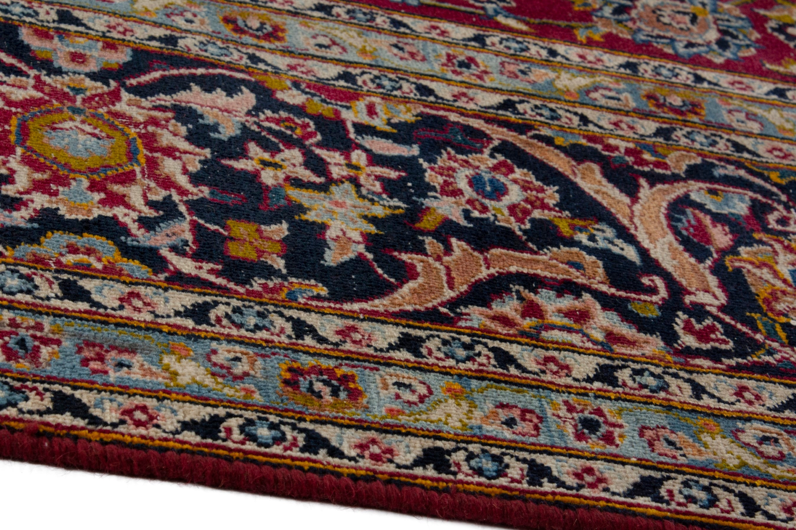 Persian Kashan oversized rug in deep red and dark brown, view 8 of 18