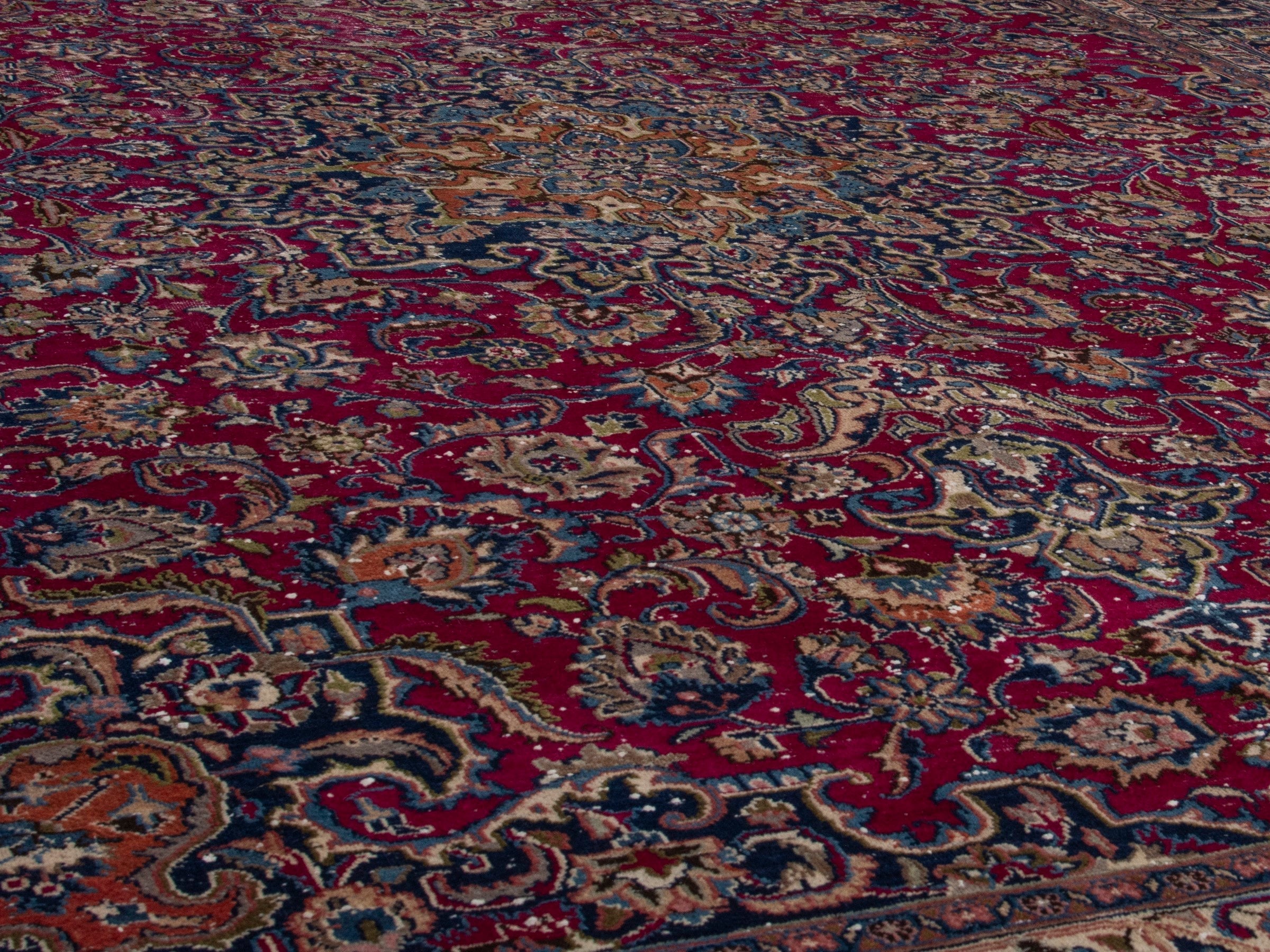 Persian Mashhad oversized rug in burgundy and navy, view 10 of 17