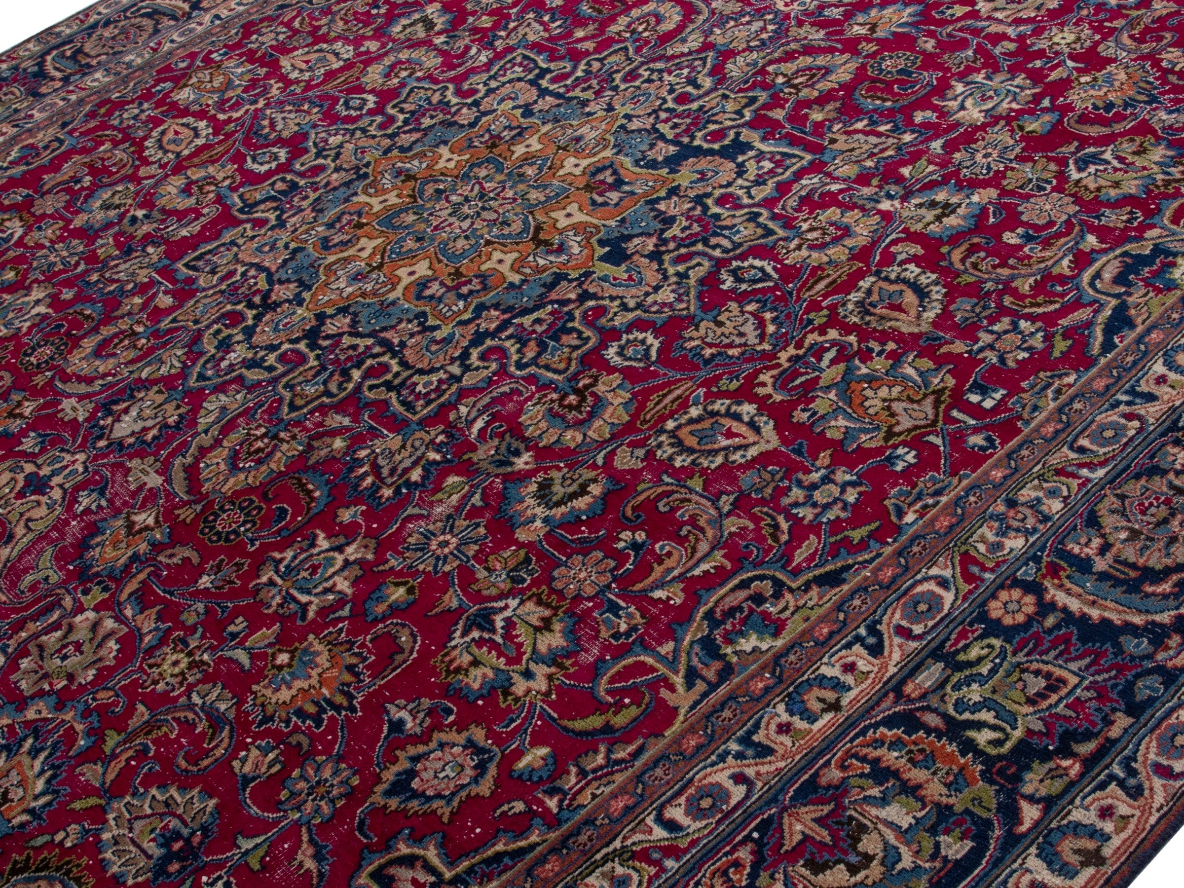Persian Mashhad oversized rug in burgundy and navy, view 4 of 17