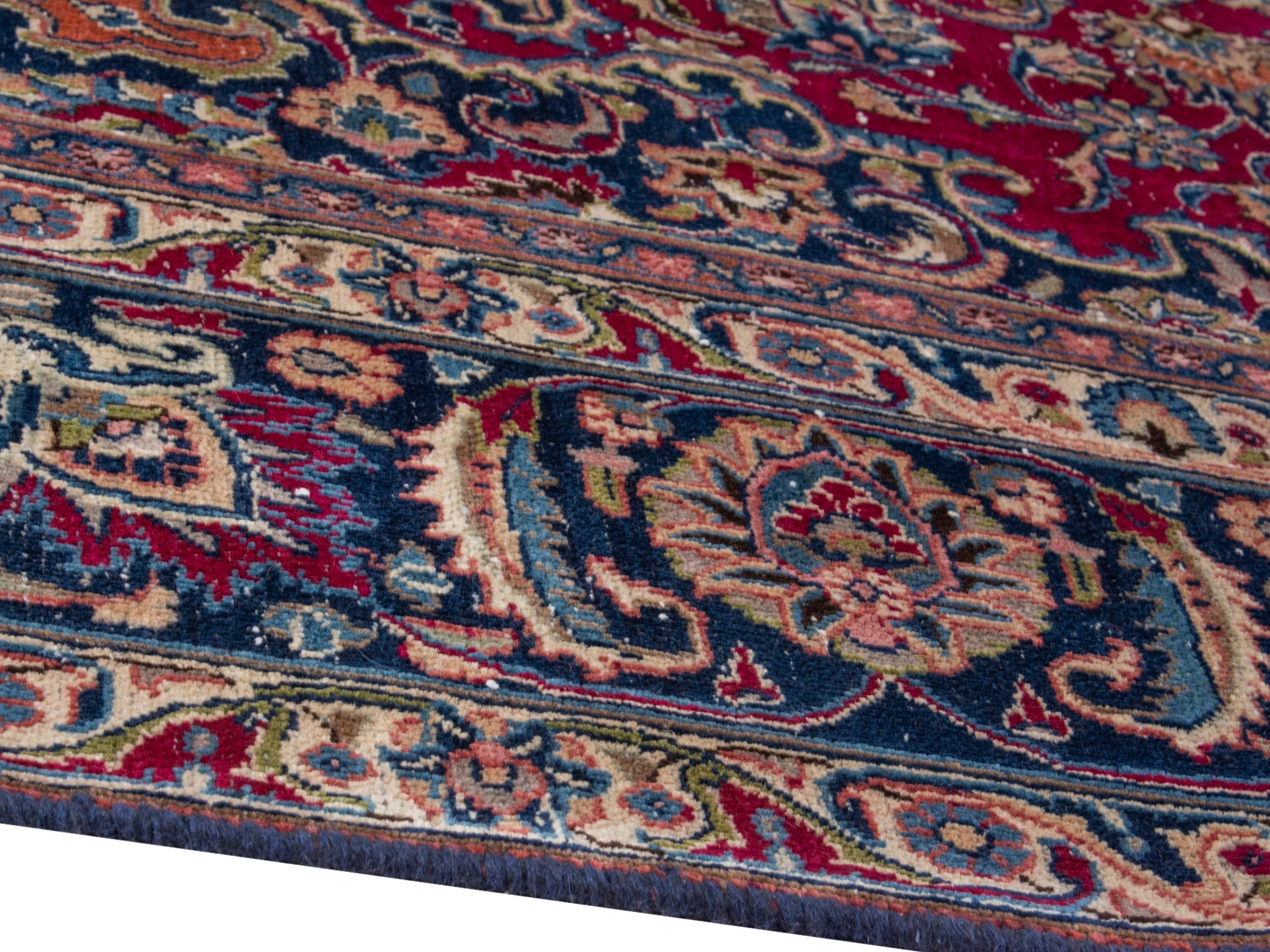 Persian Mashhad oversized rug in burgundy and navy, view 8 of 17