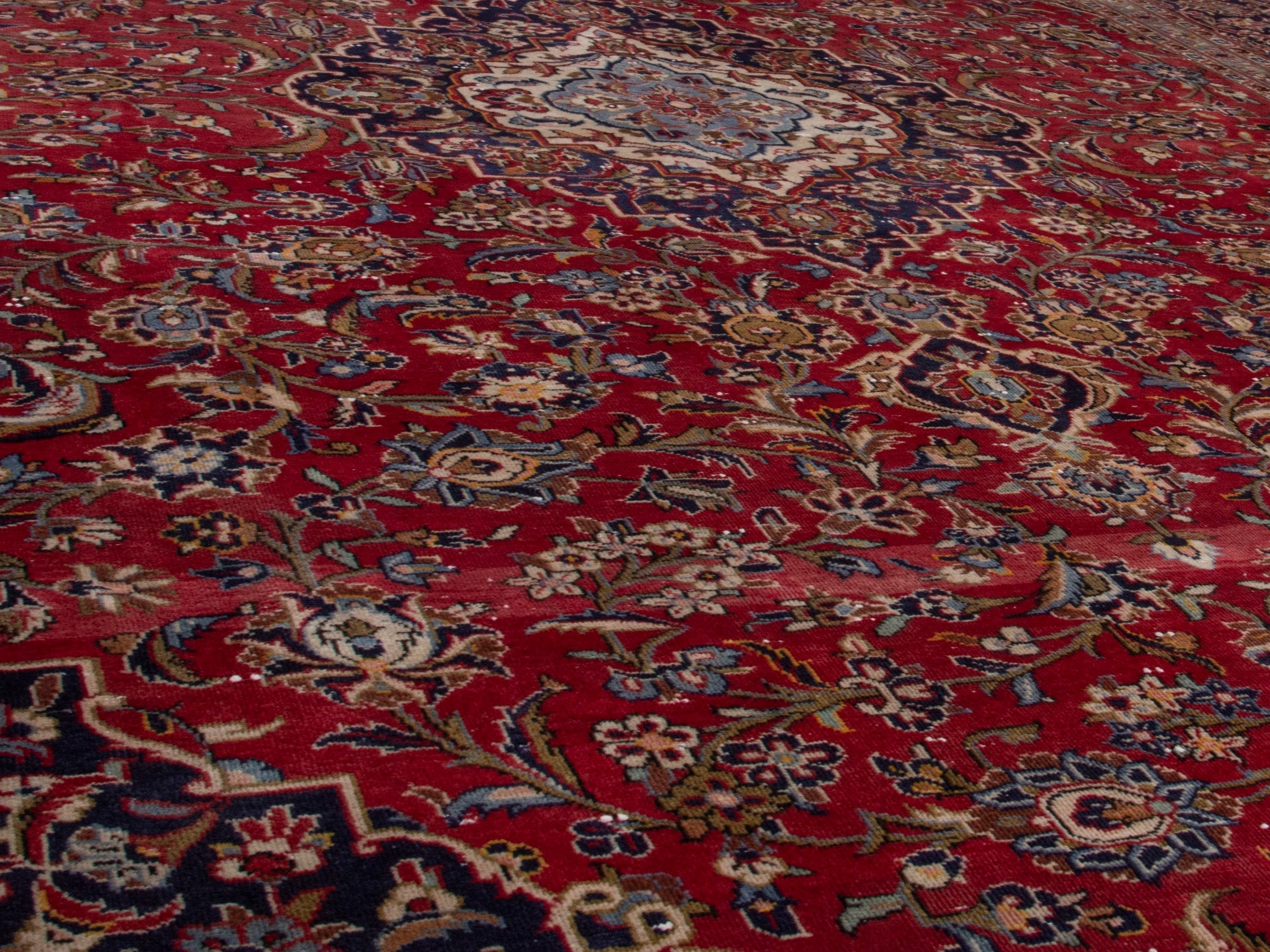 Persian Kashan oversized rug in deep red and dark brown, view 10 of 18