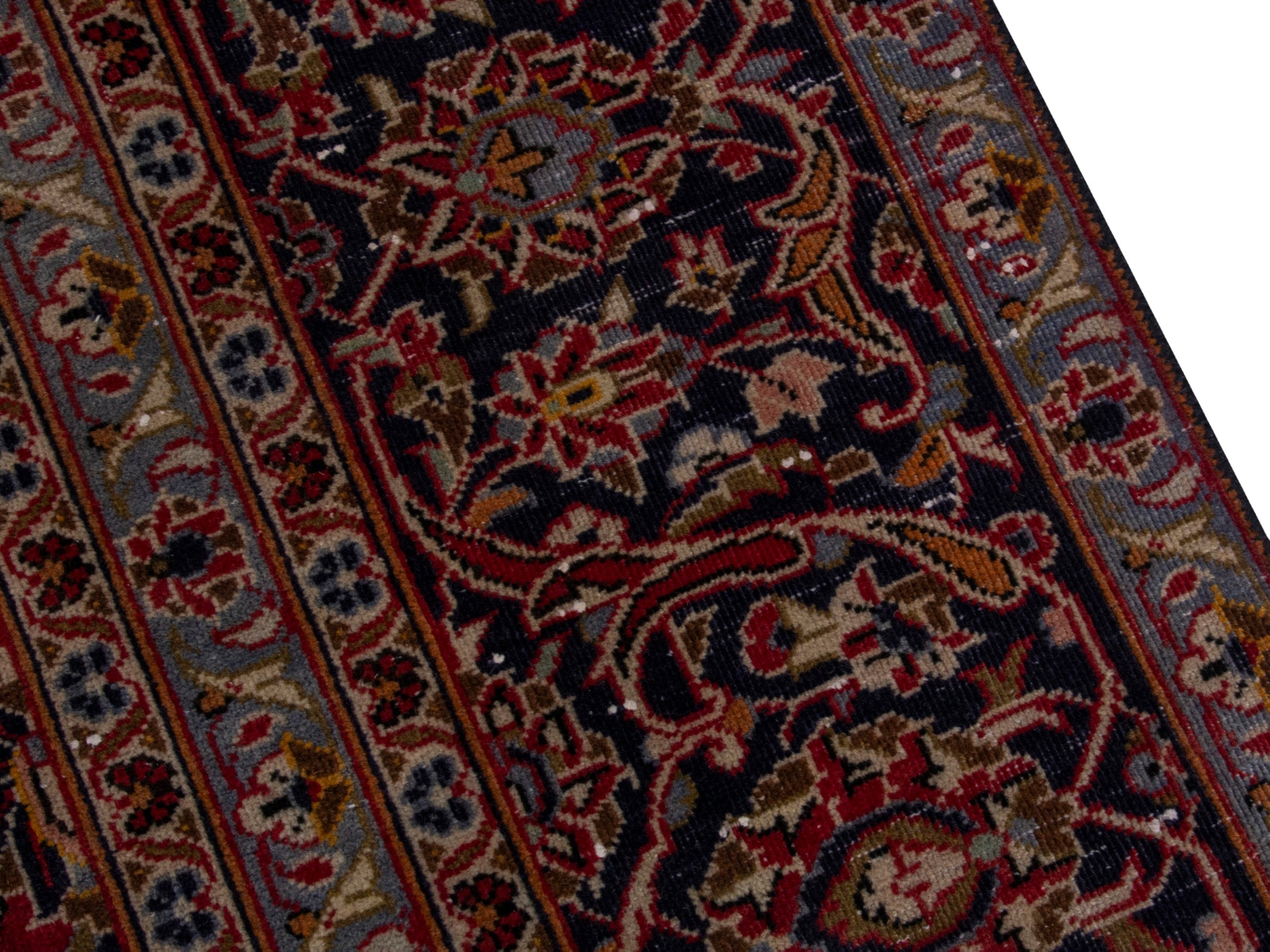Persian Kashan oversized rug in deep red and dark brown, view 7 of 18