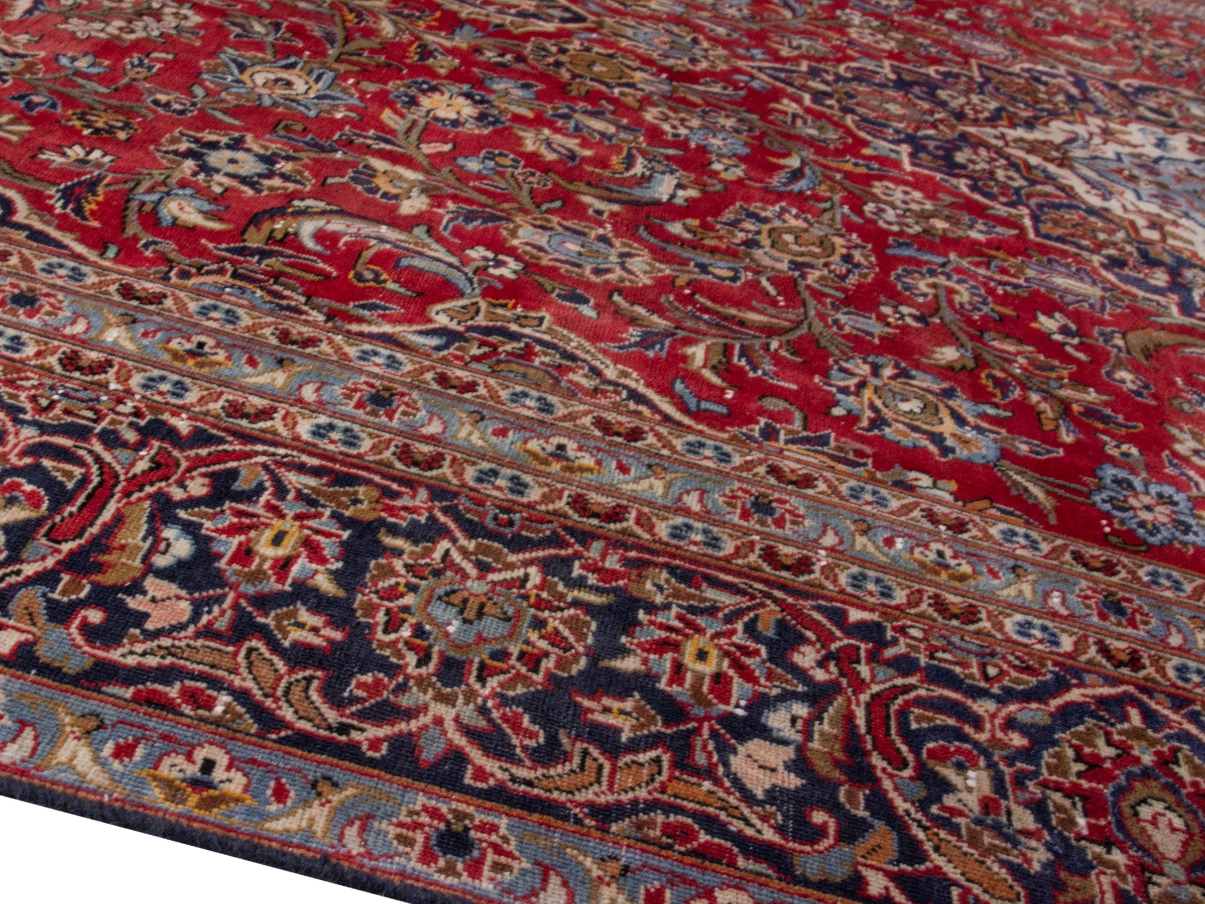 Persian Kashan oversized rug in deep red and dark brown, view 8 of 18