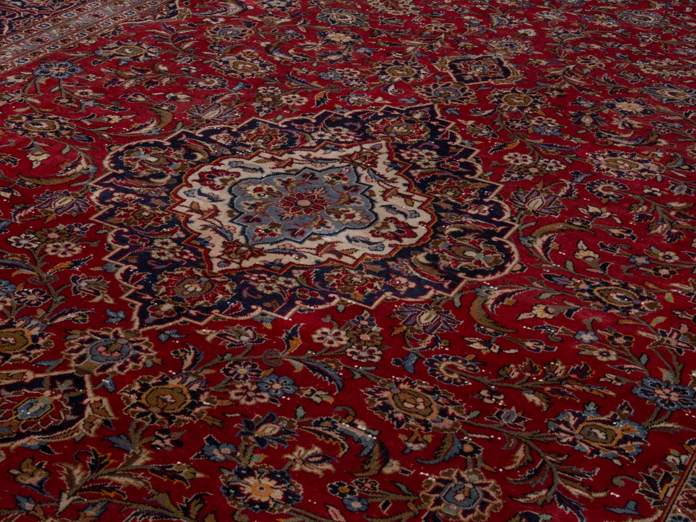 Persian Kashan oversized rug in deep red and dark brown, view 9 of 18