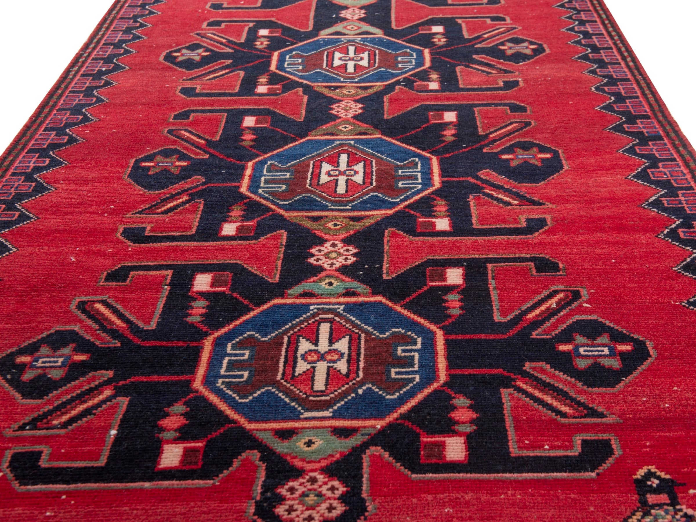 Persian Saveh runner rug in deep red and dark blue, view 10 of 17