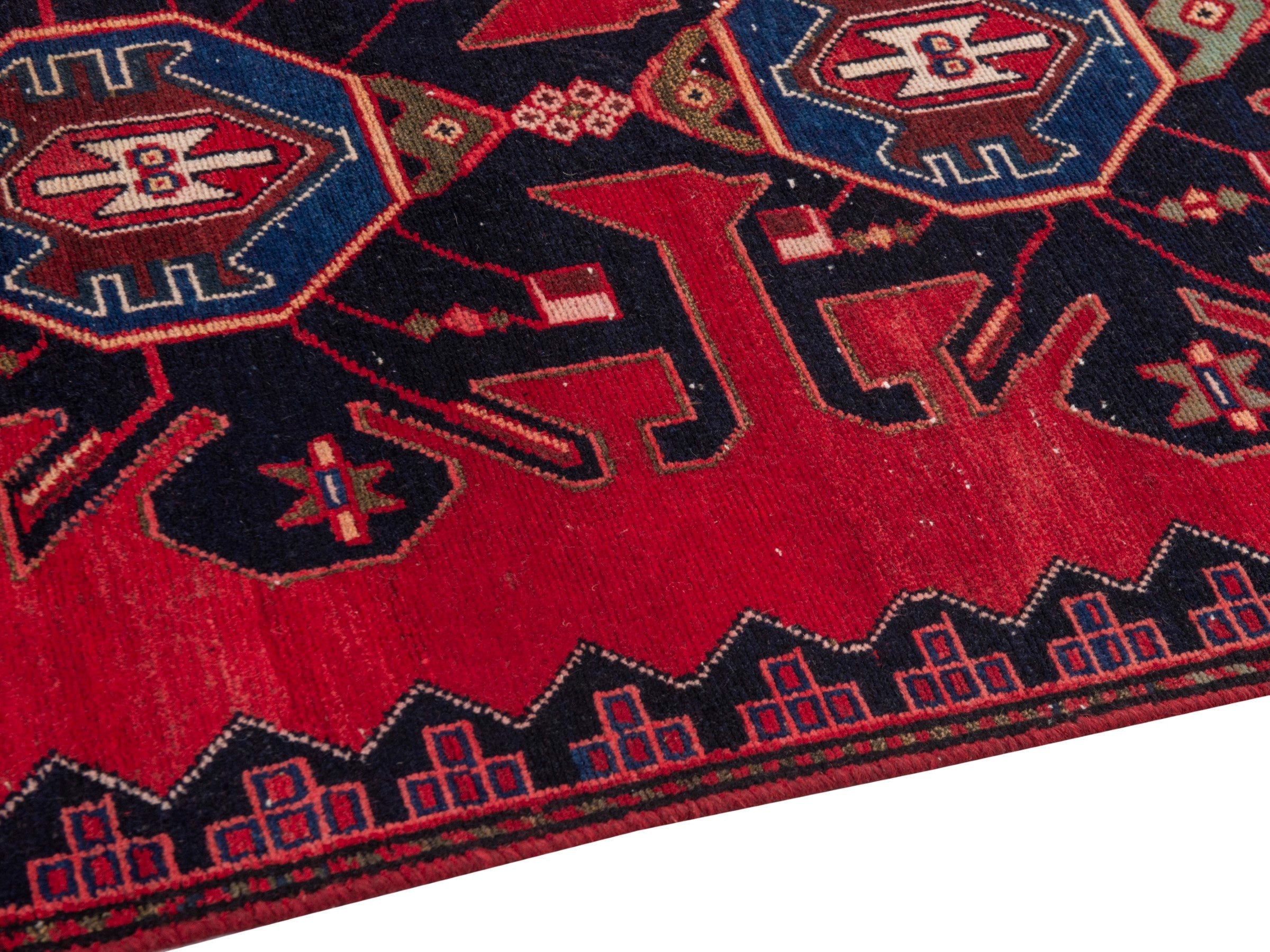 Persian Saveh runner rug in deep red and dark blue, view 8 of 17