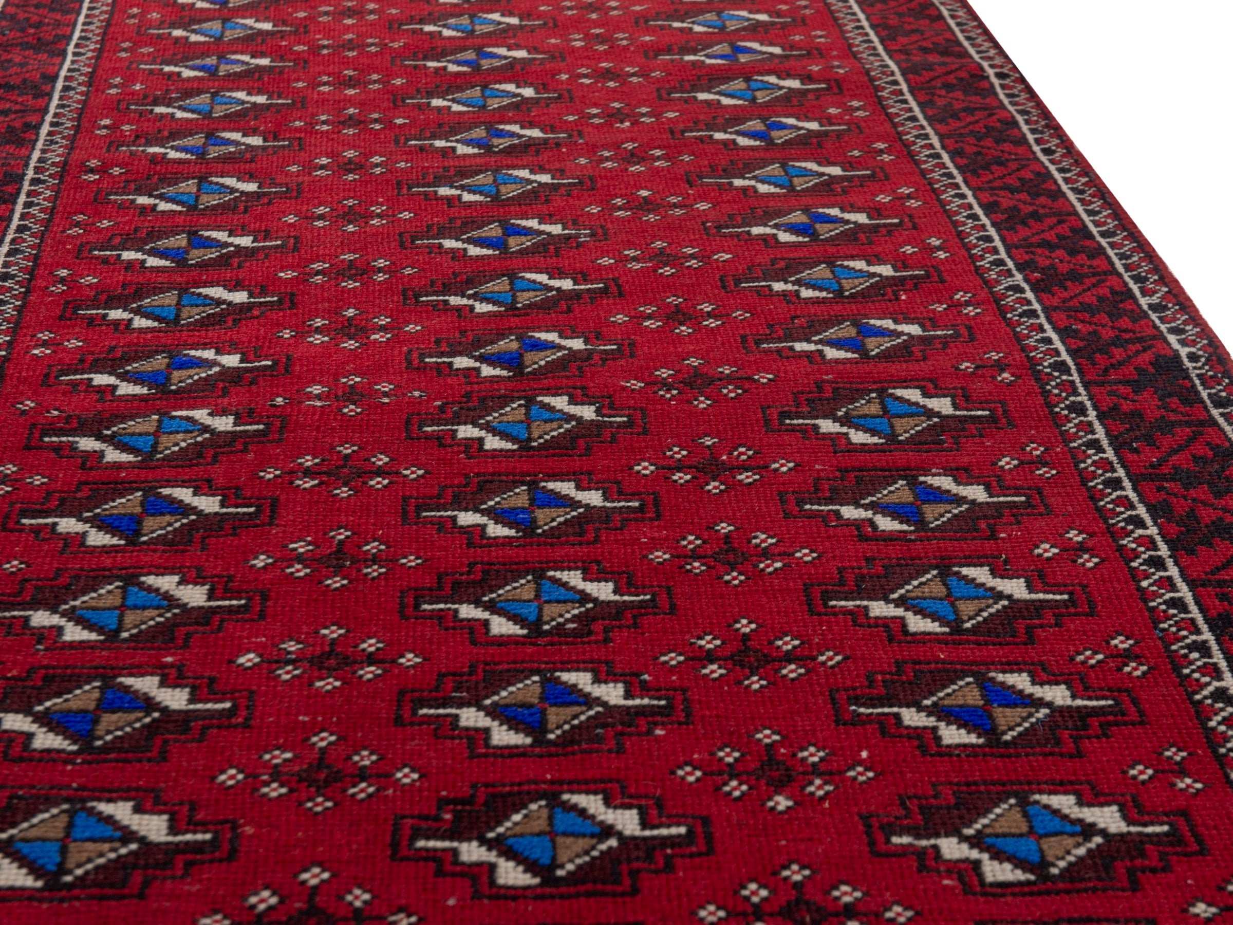 Persian Baluch runner rug in deep red and navy, view 10 of 17