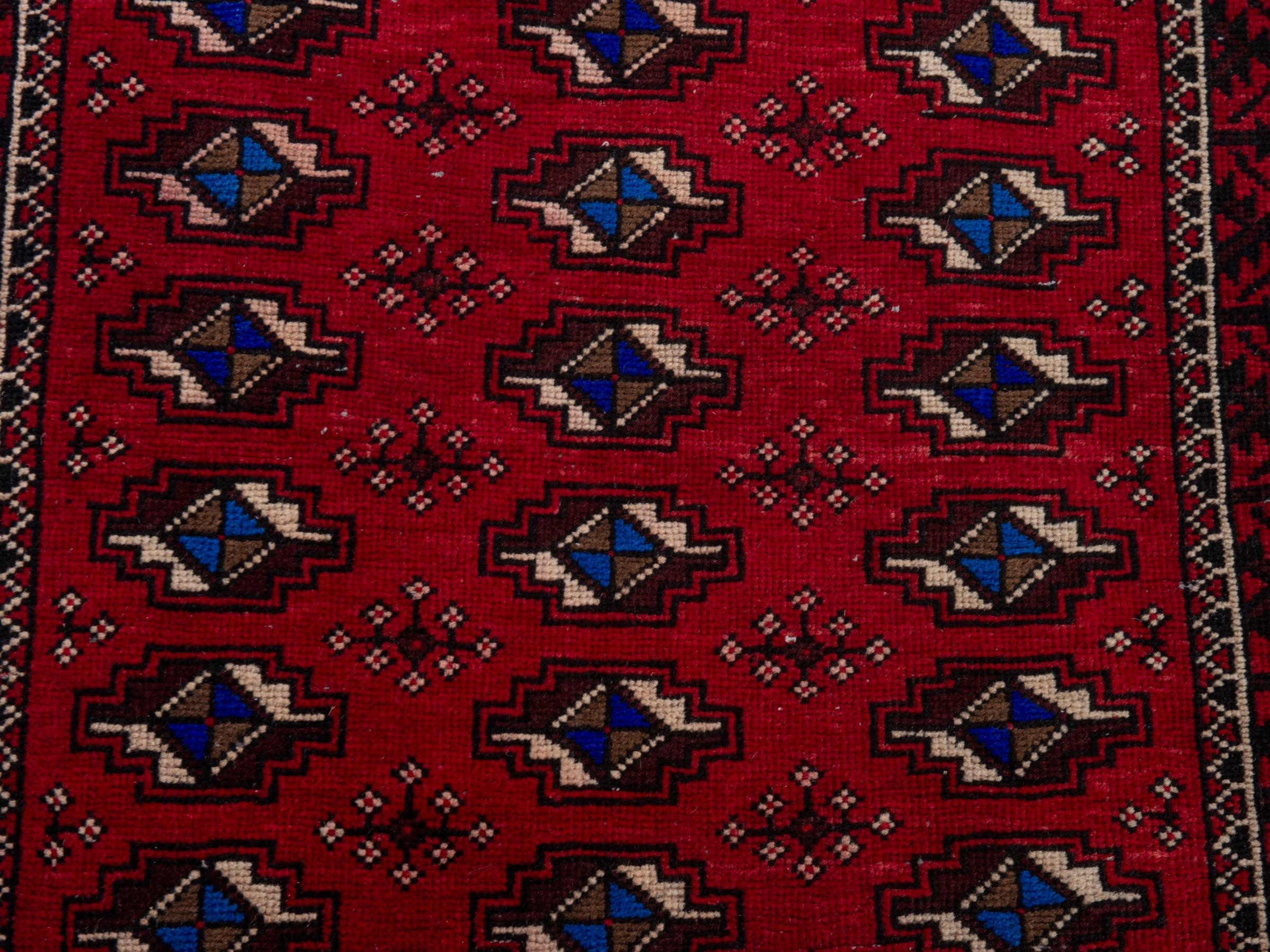 Persian Baluch runner rug in deep red and navy, view 13 of 17