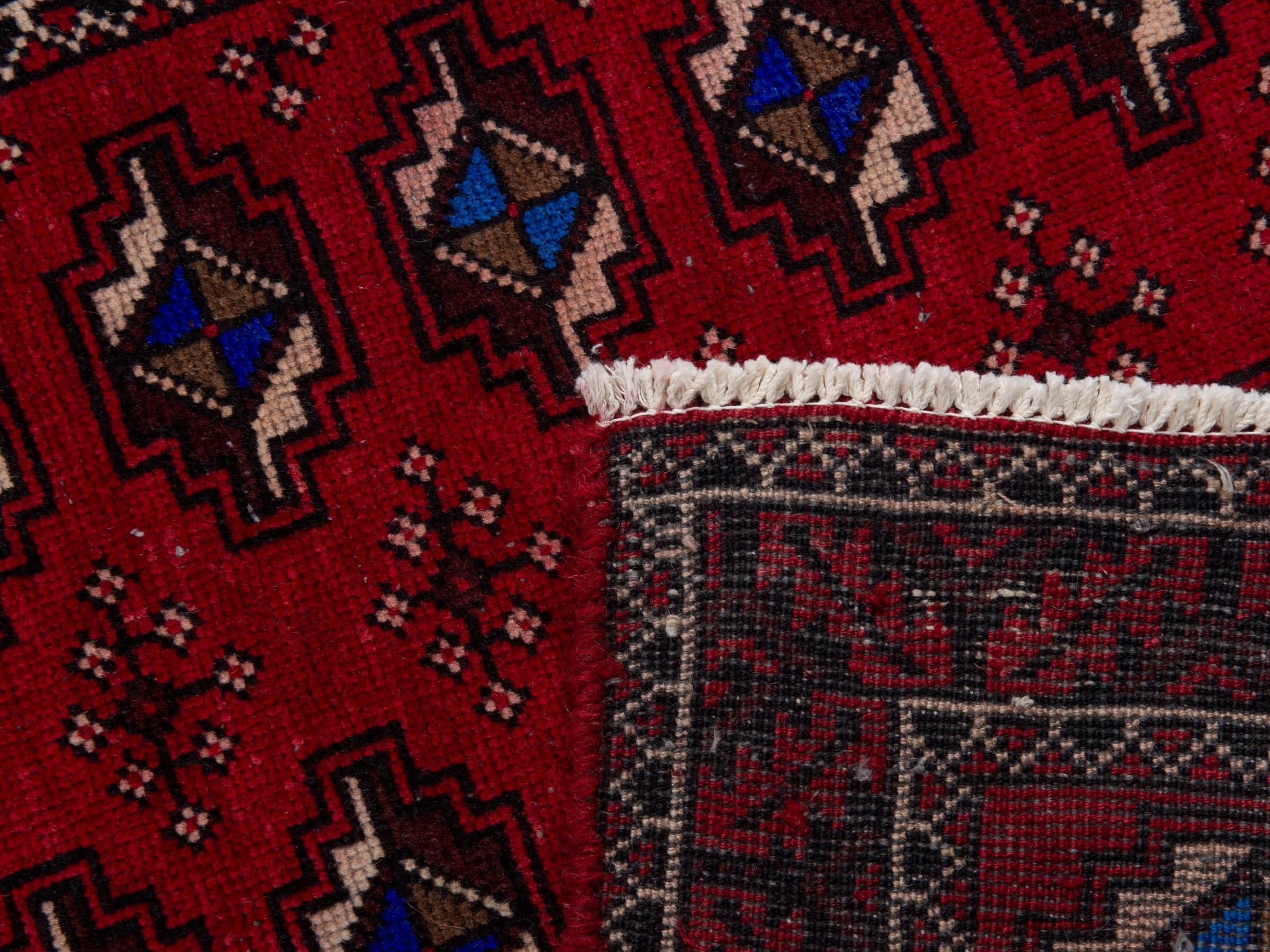 Persian Baluch runner rug in deep red and navy, view 17 of 17