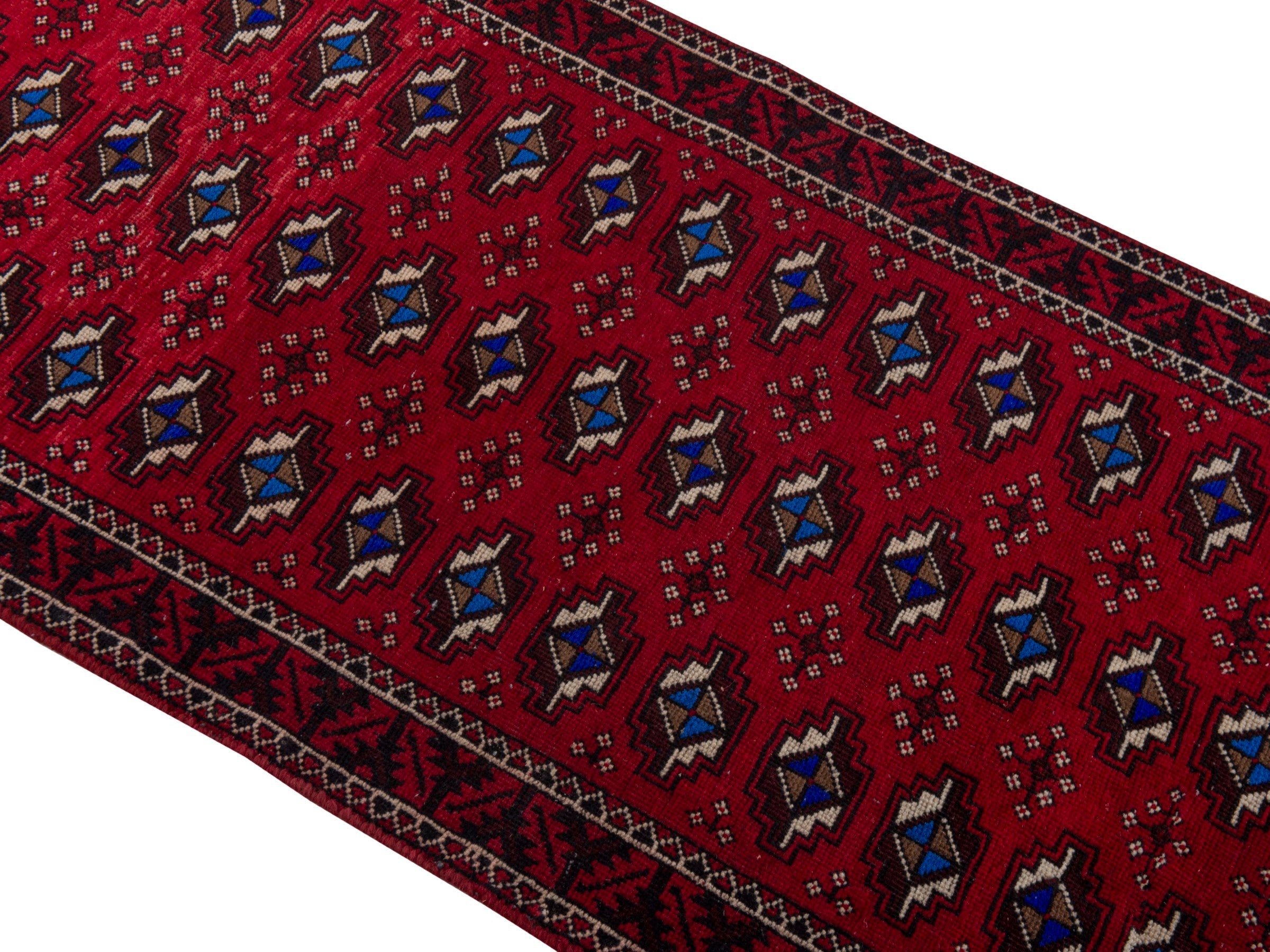 Persian Baluch runner rug in deep red and navy, view 4 of 17