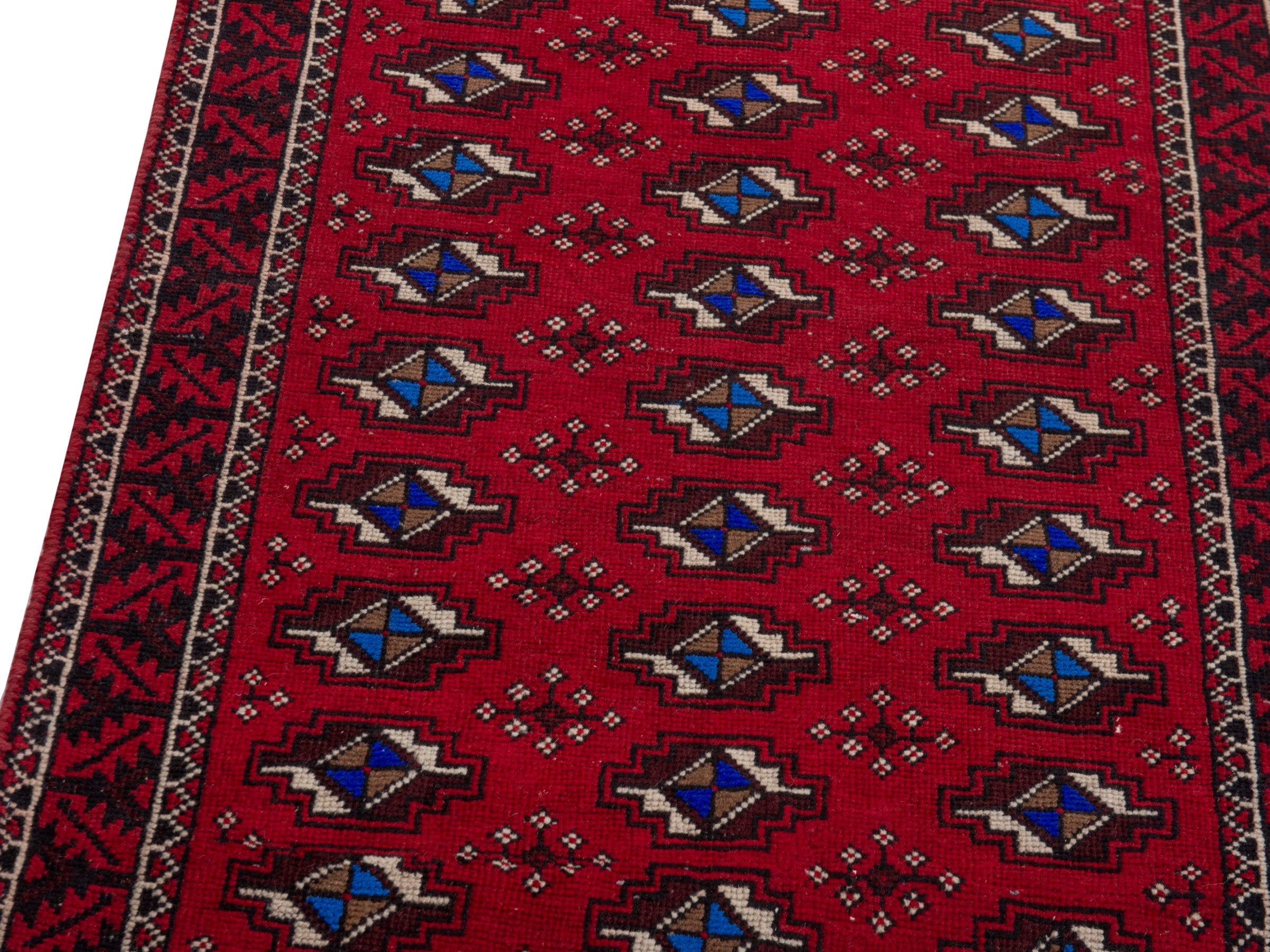 Persian Baluch runner rug in deep red and navy, view 7 of 17