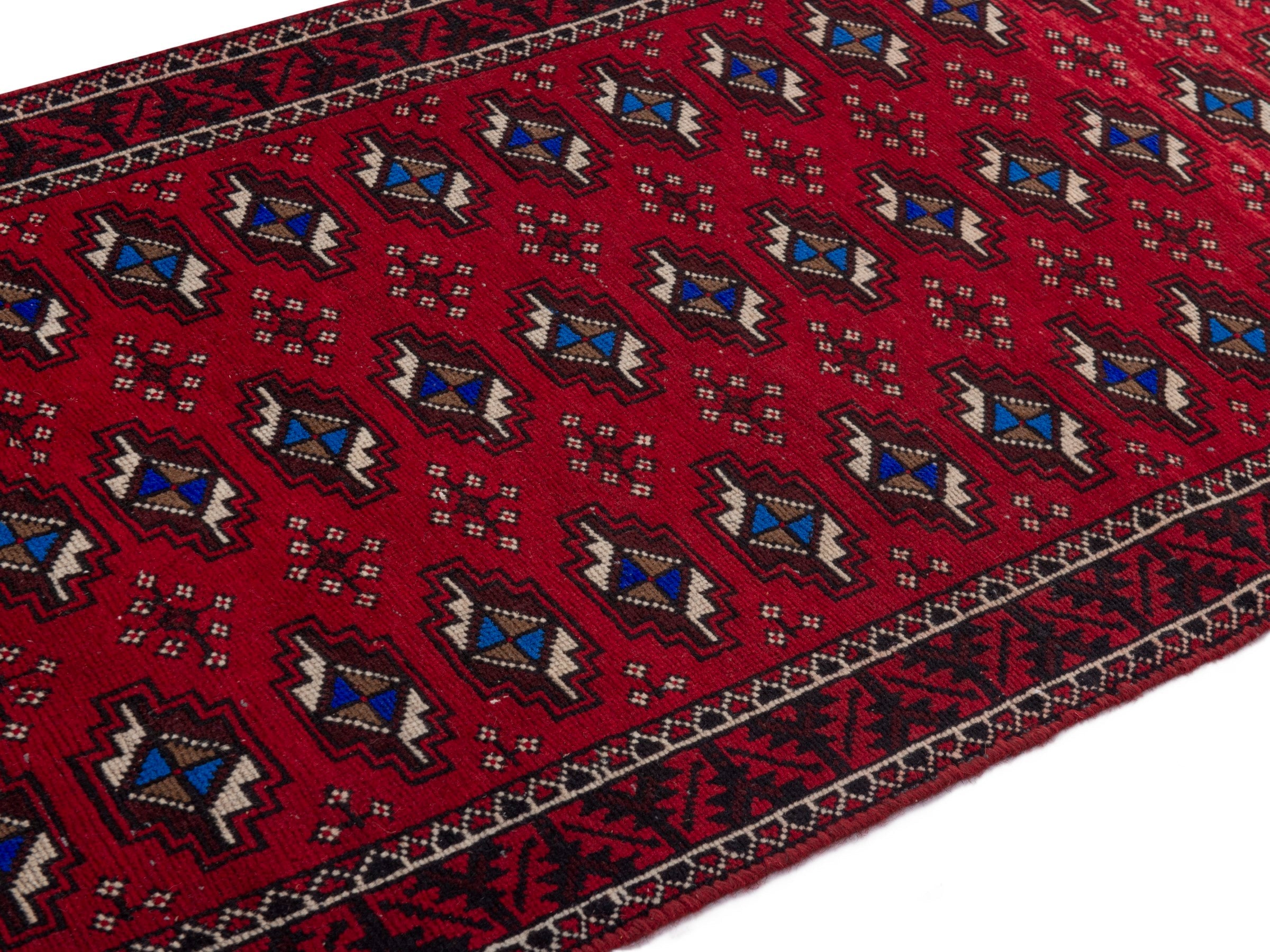 Persian Baluch runner rug in deep red and navy, view 8 of 17