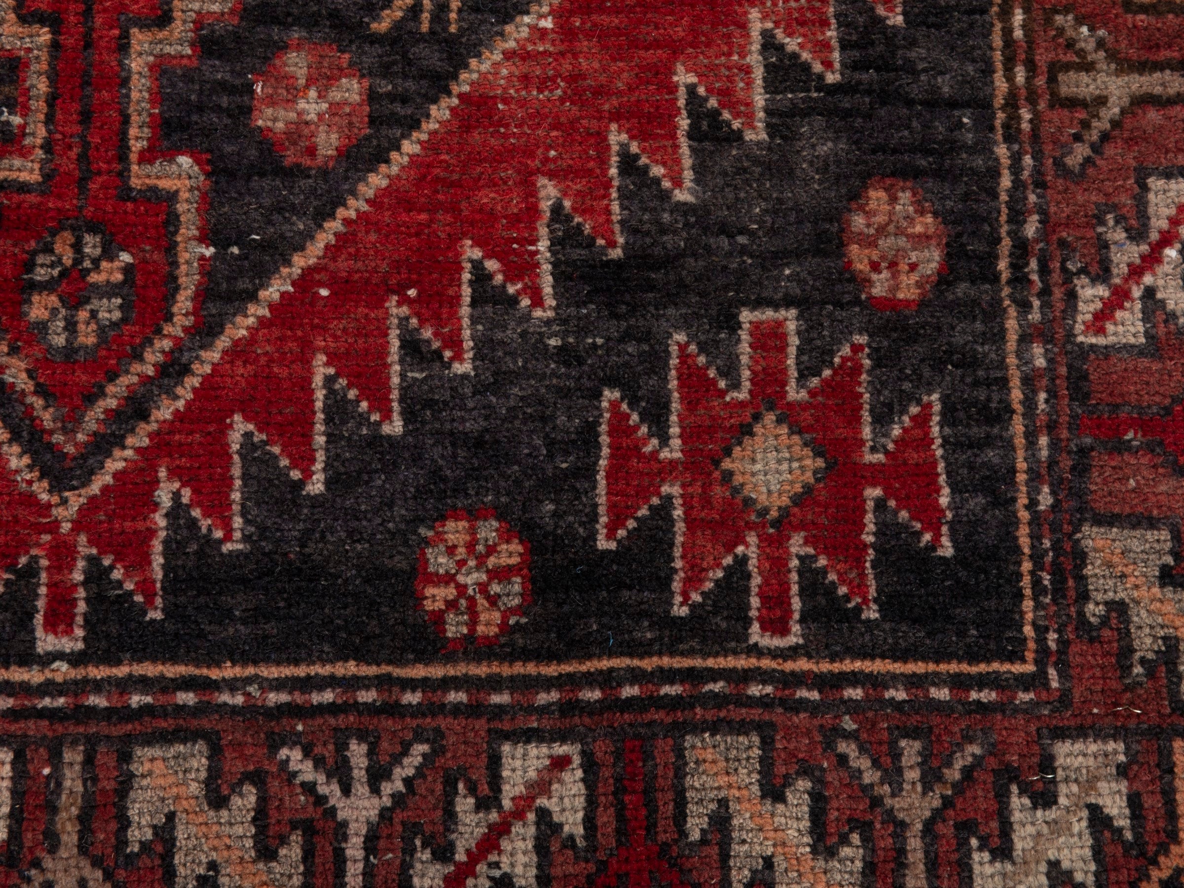 Persian Saveh runner rug in deep red and charcoal, view 11 of 18