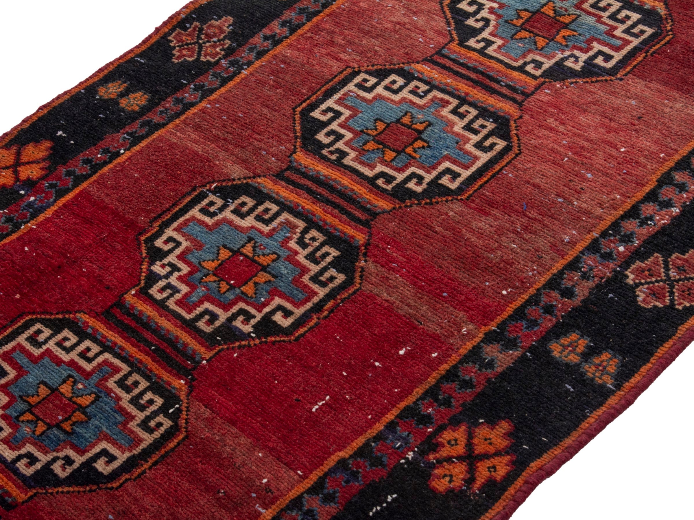 Persian Saveh runner rug in deep red and navy, view 4 of 17