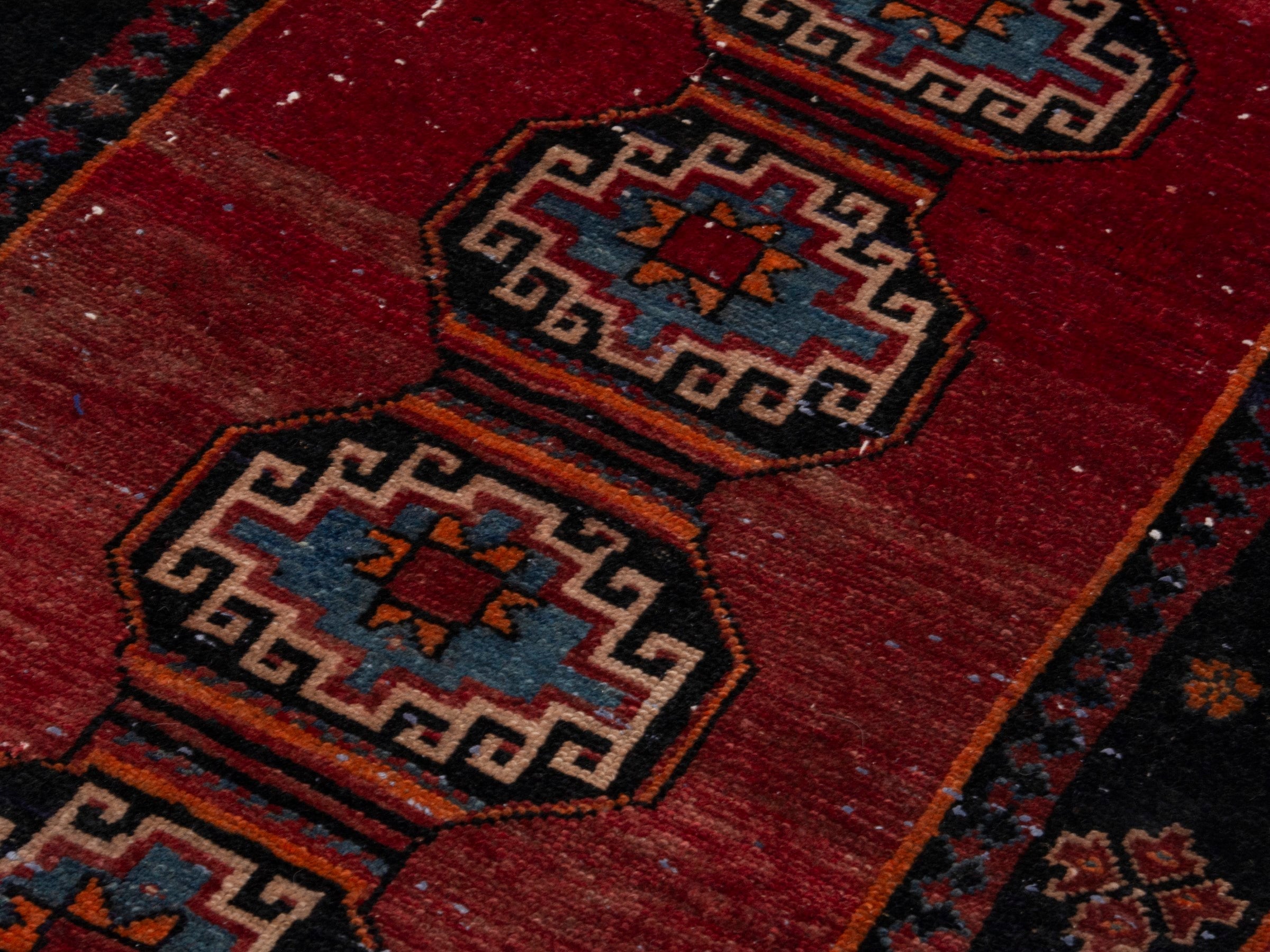 Persian Saveh runner rug in deep red and navy, view 9 of 17