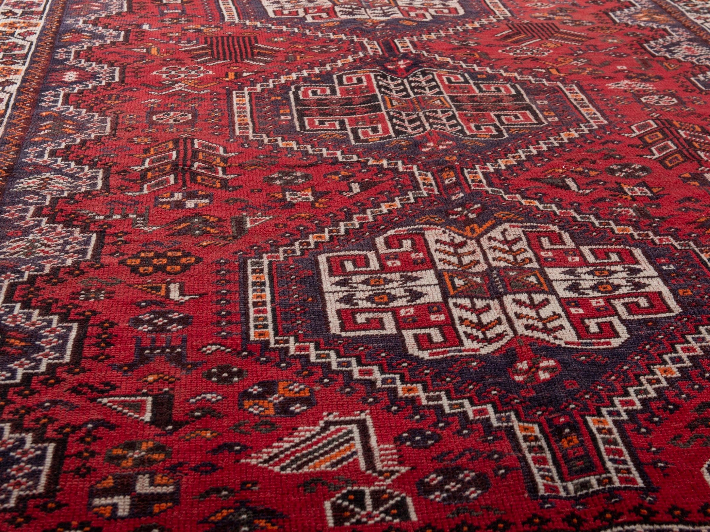Persian Shiraz area rug in deep red and cream, view 10 of 19