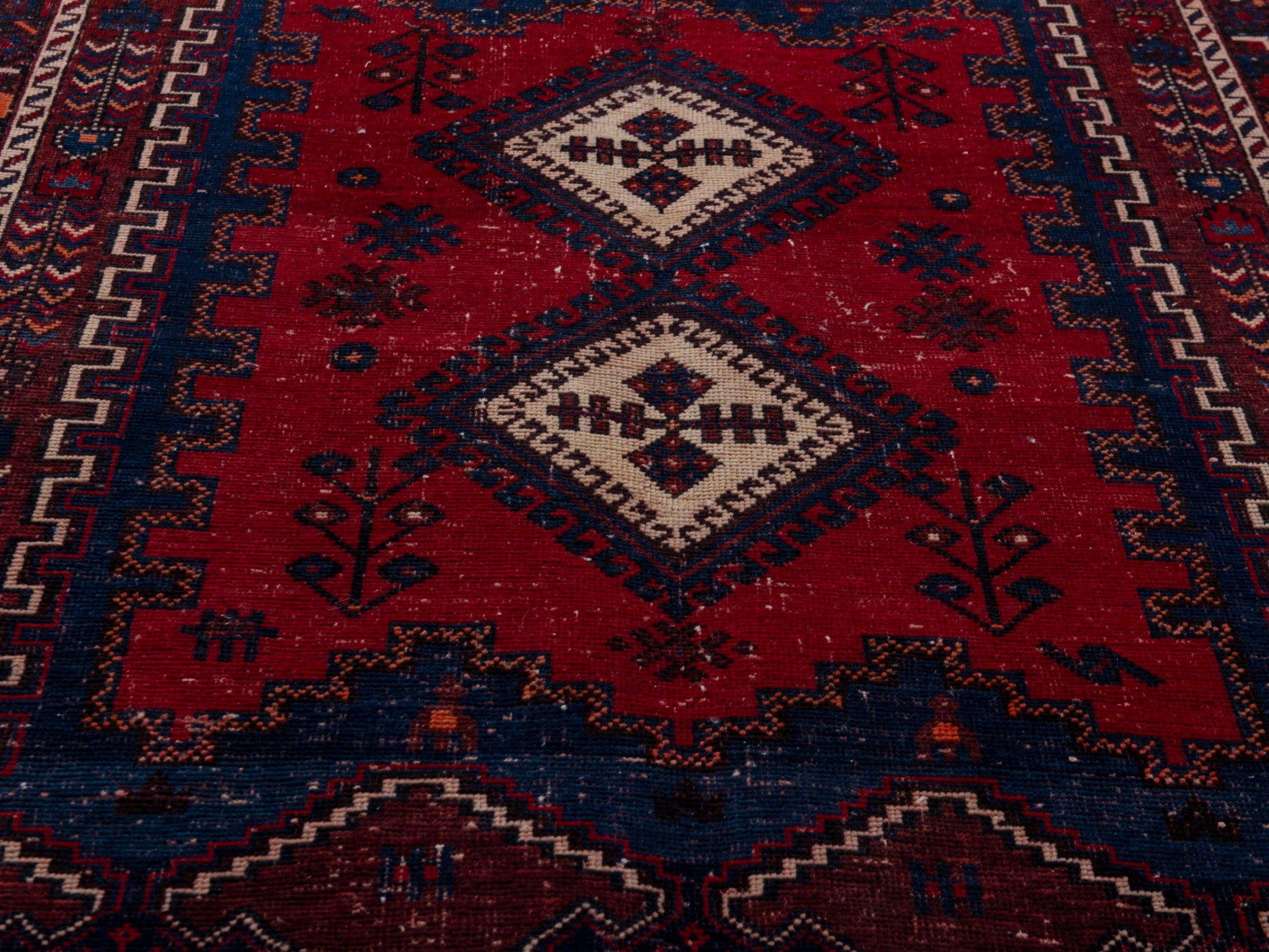 Persian Sirjan accent rug in deep red and navy, view 10 of 19