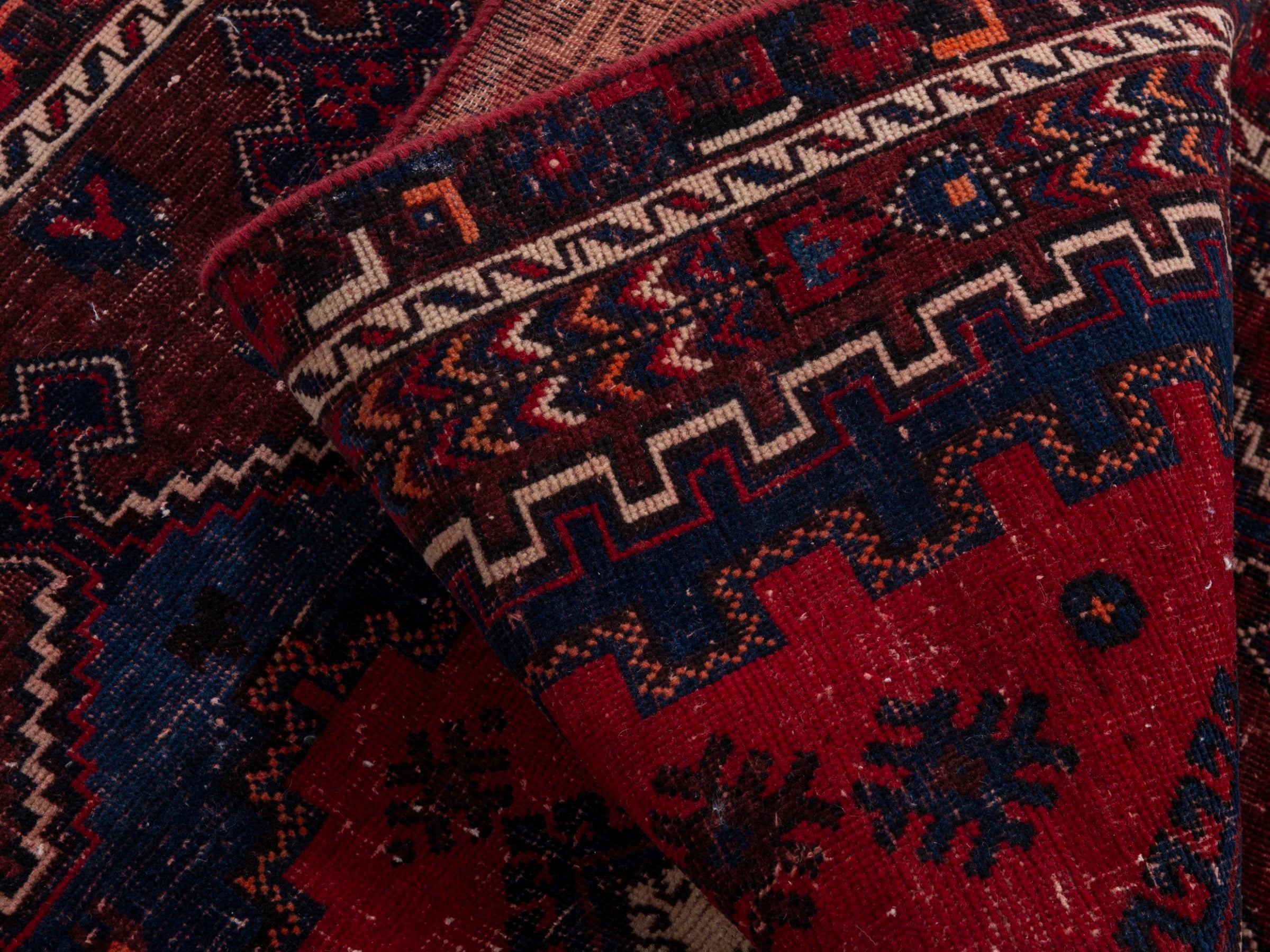 Persian Sirjan accent rug in deep red and navy, view 17 of 19