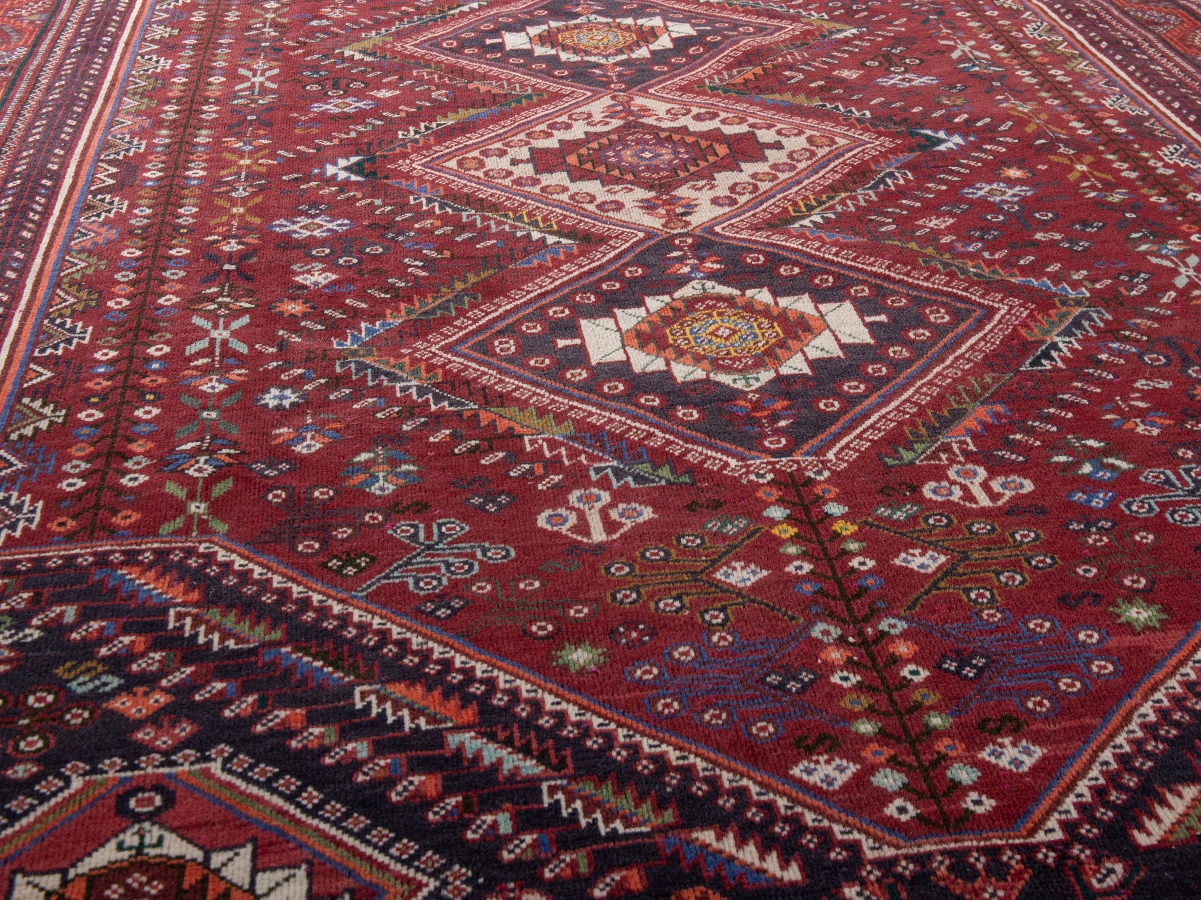 Persian Shiraz area rug in burgundy and deep red, view 10 of 20