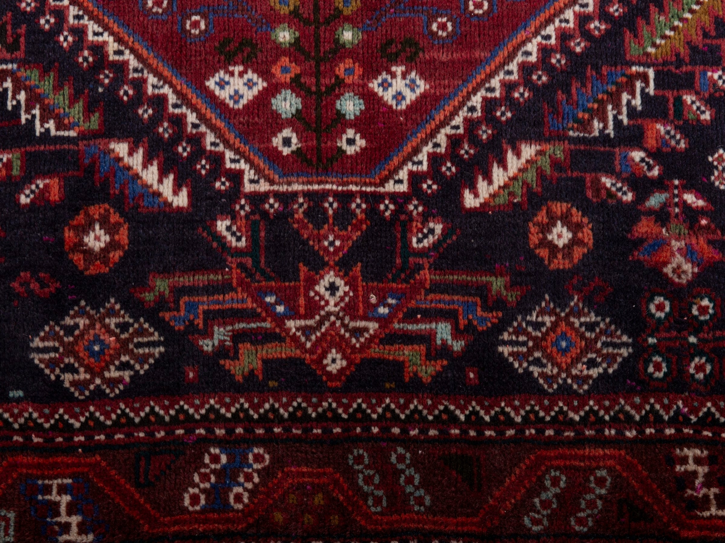 Persian Shiraz area rug in burgundy and deep red, view 11 of 20
