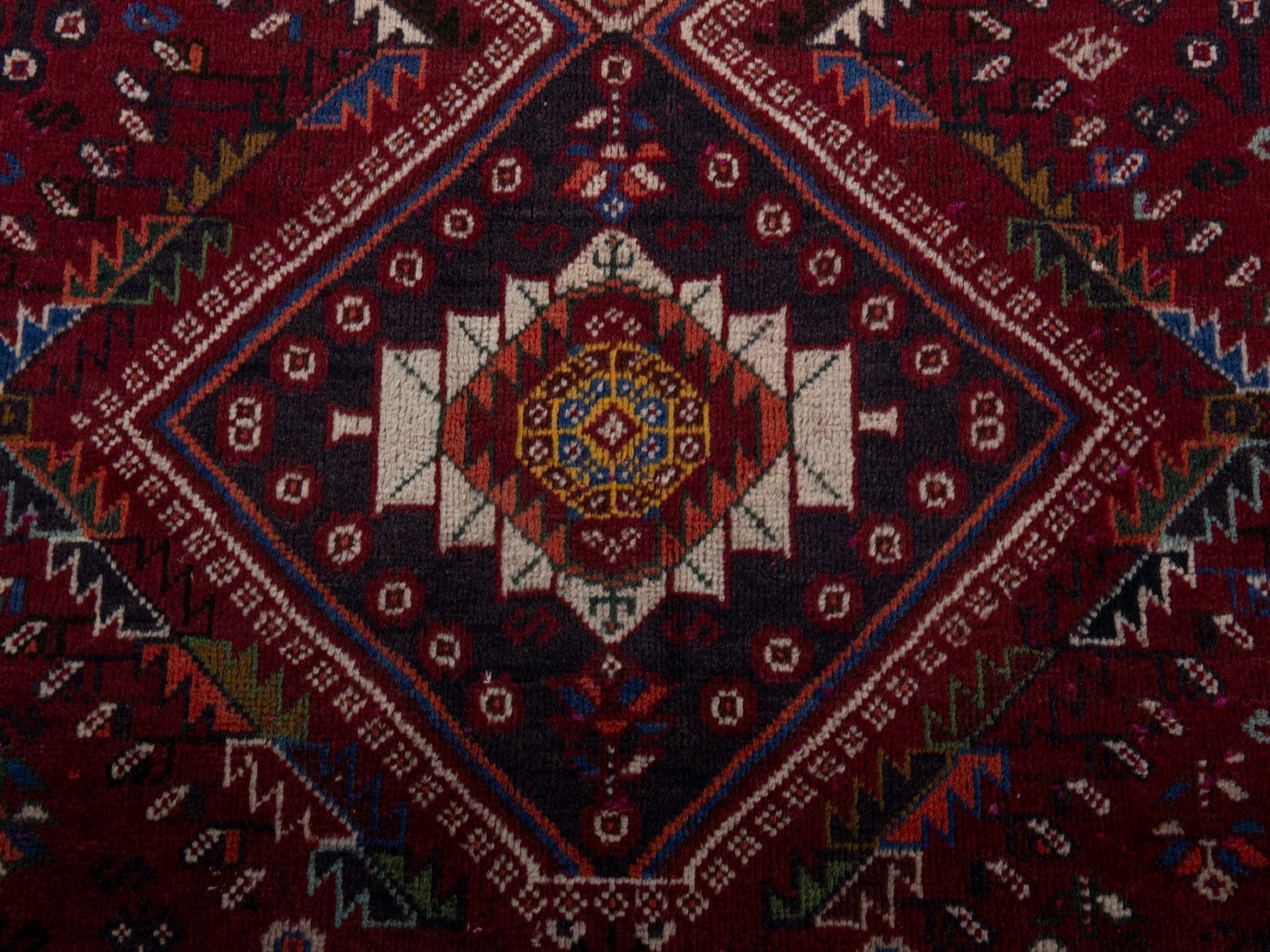 Persian Shiraz area rug in burgundy and deep red, view 13 of 20