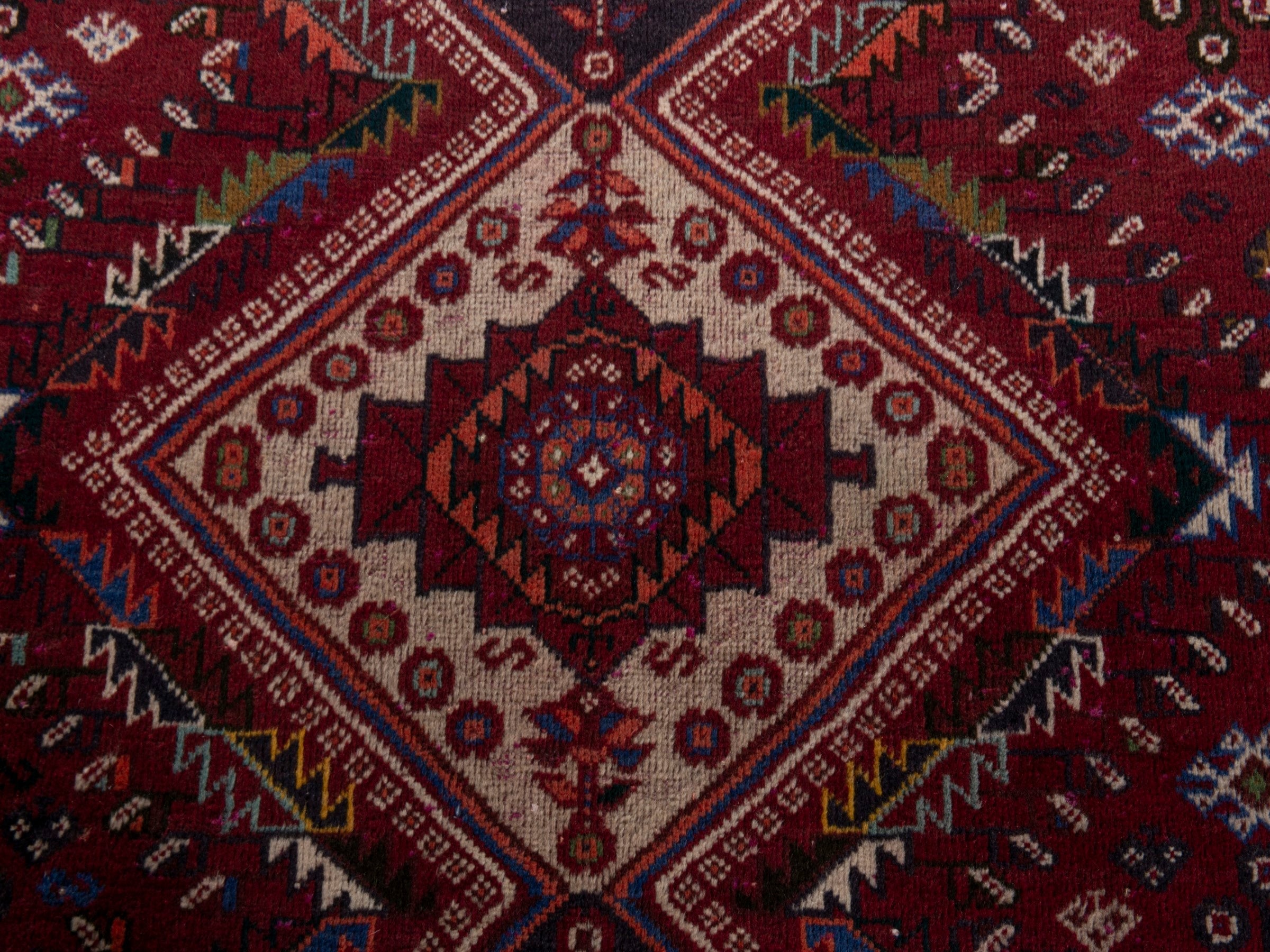 Persian Shiraz area rug in burgundy and deep red, view 14 of 20