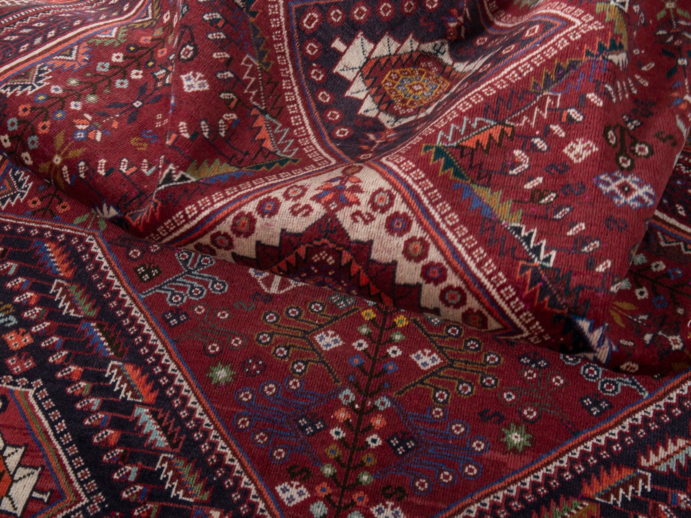 Persian Shiraz area rug in burgundy and deep red, view 18 of 20