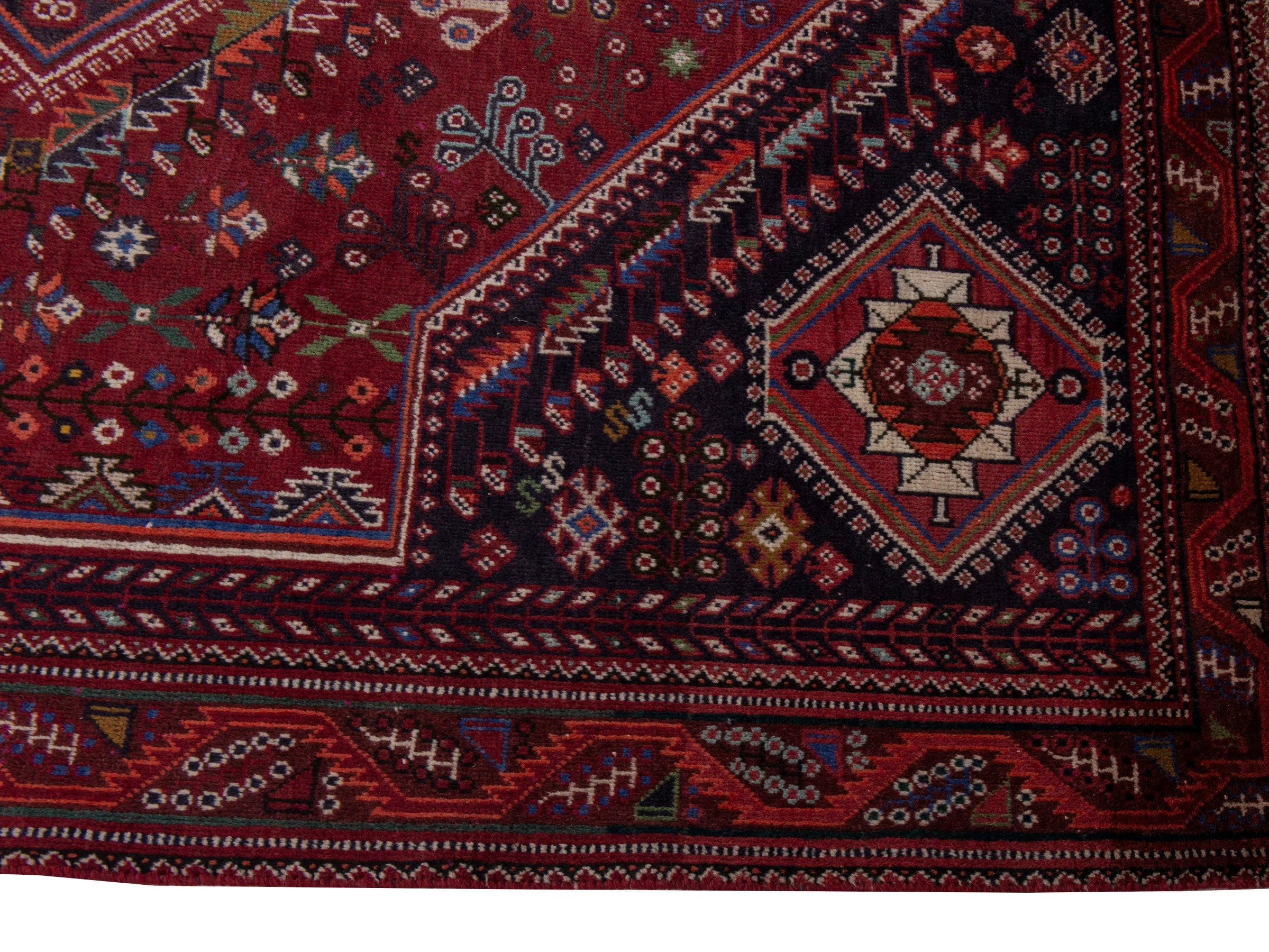 Persian Shiraz area rug in burgundy and deep red, view 5 of 20