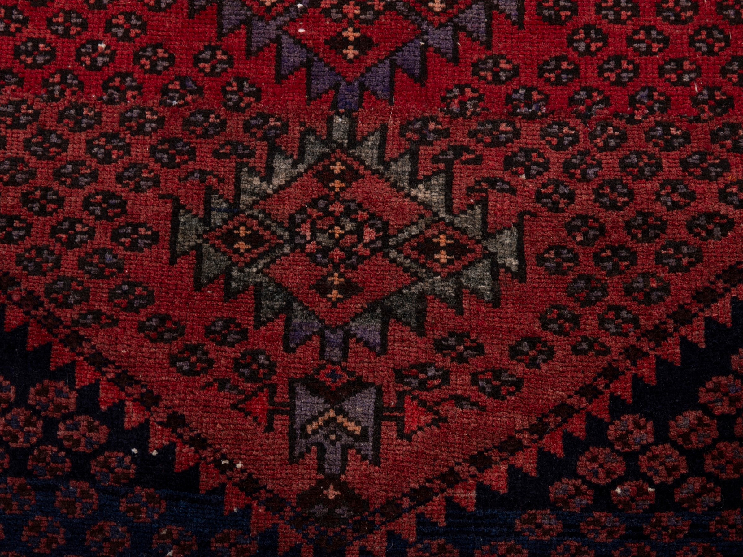 Persian Zanjan accent rug in navy and rust, view 11 of 17